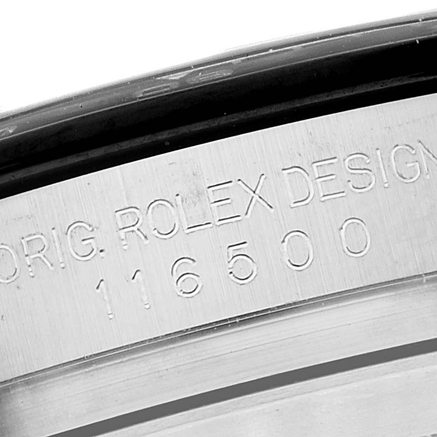 This image shows a close-up of the engraved bezel on a Rolex Daytona 116500 Men
s Stainless Steel White Dial 116500 Men
s Stainless Steel White Dial watch with model number 116500.