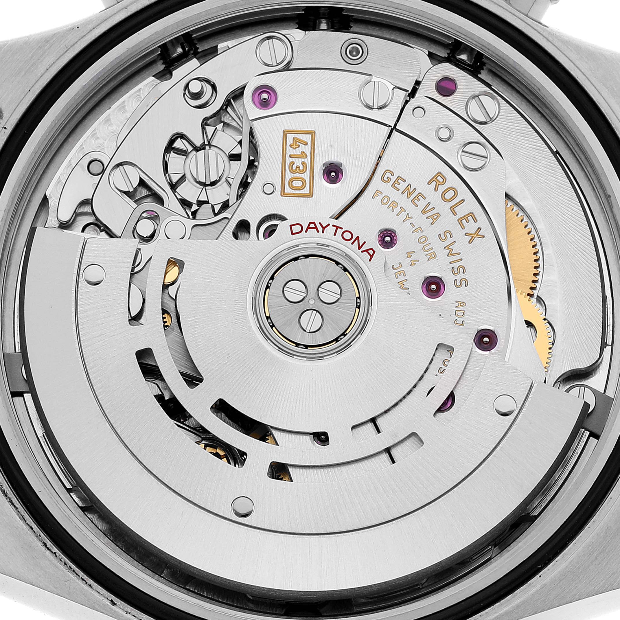 The image shows a close-up view of the movement mechanism of a Rolex Daytona 116500 Men
s Stainless Steel White Dial 116500 Men
s Stainless Steel White Dial watch.