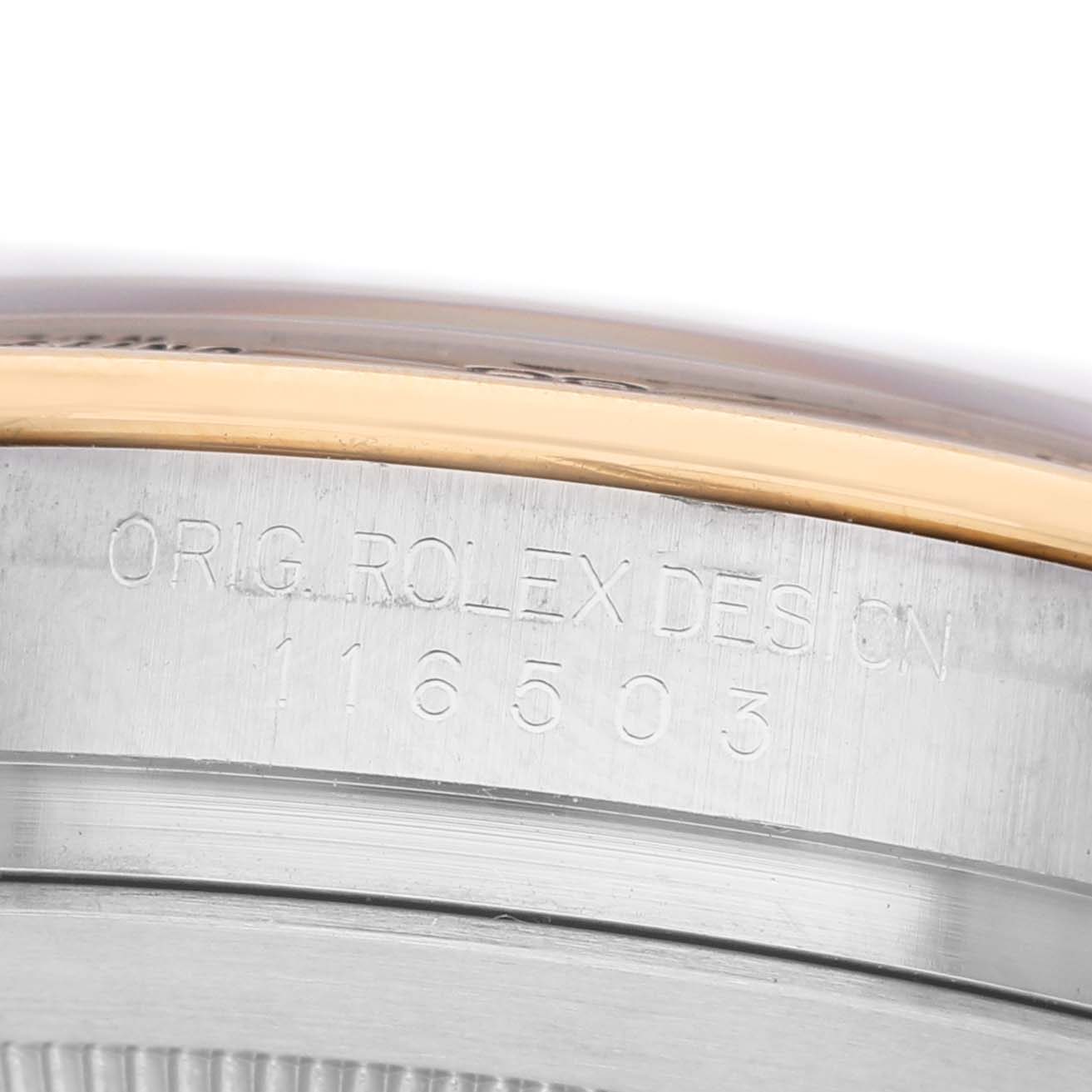 The image shows a close-up of the side of a Rolex Daytona 116503 Men's Steel and Gold (two tone) Blue Dial, focusing on the model number engraved on the case.