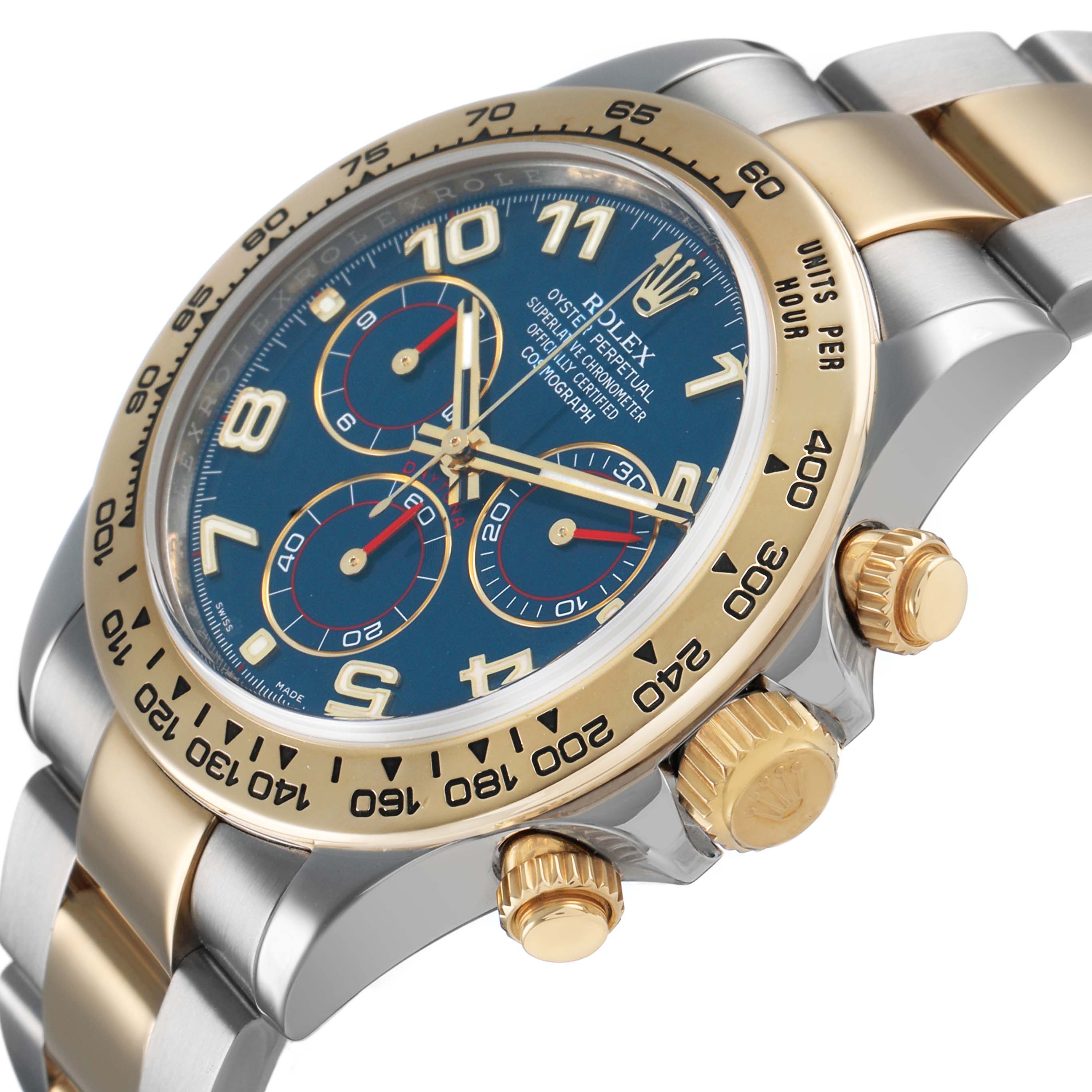 The Rolex Daytona 116503 Men's Steel and Gold (two tone) Blue Dial watch is shown at an angle highlighting the face, gold bezel, and pushers.