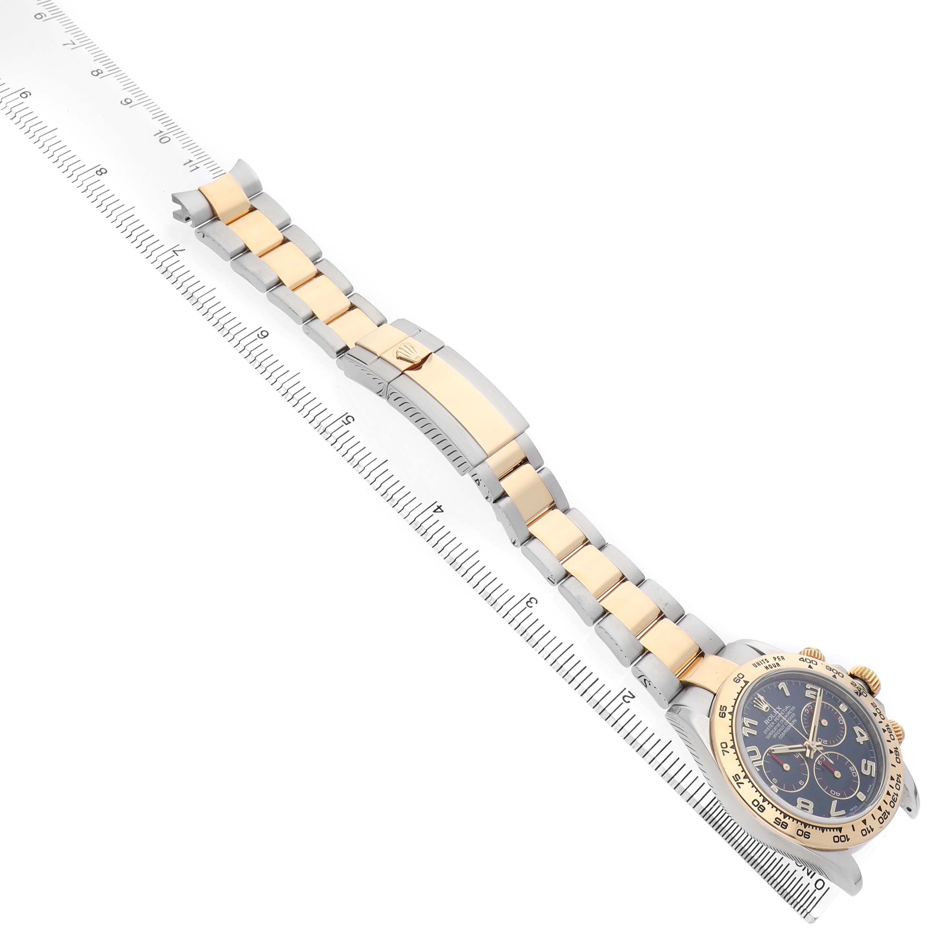 The Rolex Daytona 116503 Men's Steel and Gold (two tone) Blue Dial watch is shown at a diagonal angle, displaying the face, bracelet, and clasp.