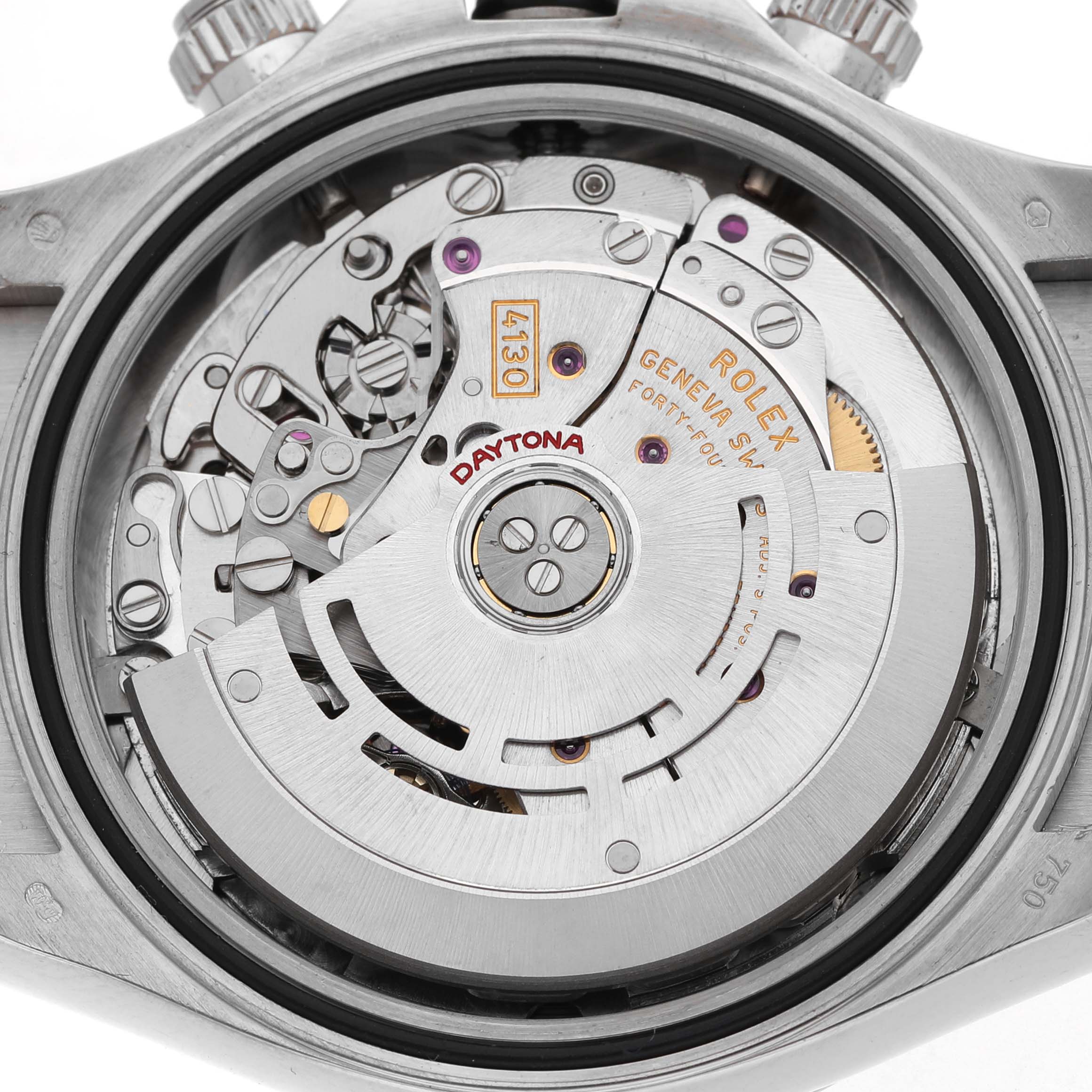 The image shows the movement of a Rolex Daytona 116519 Men's White Gold Silver Dial watch, viewed from the back, highlighting the intricate mechanical components.