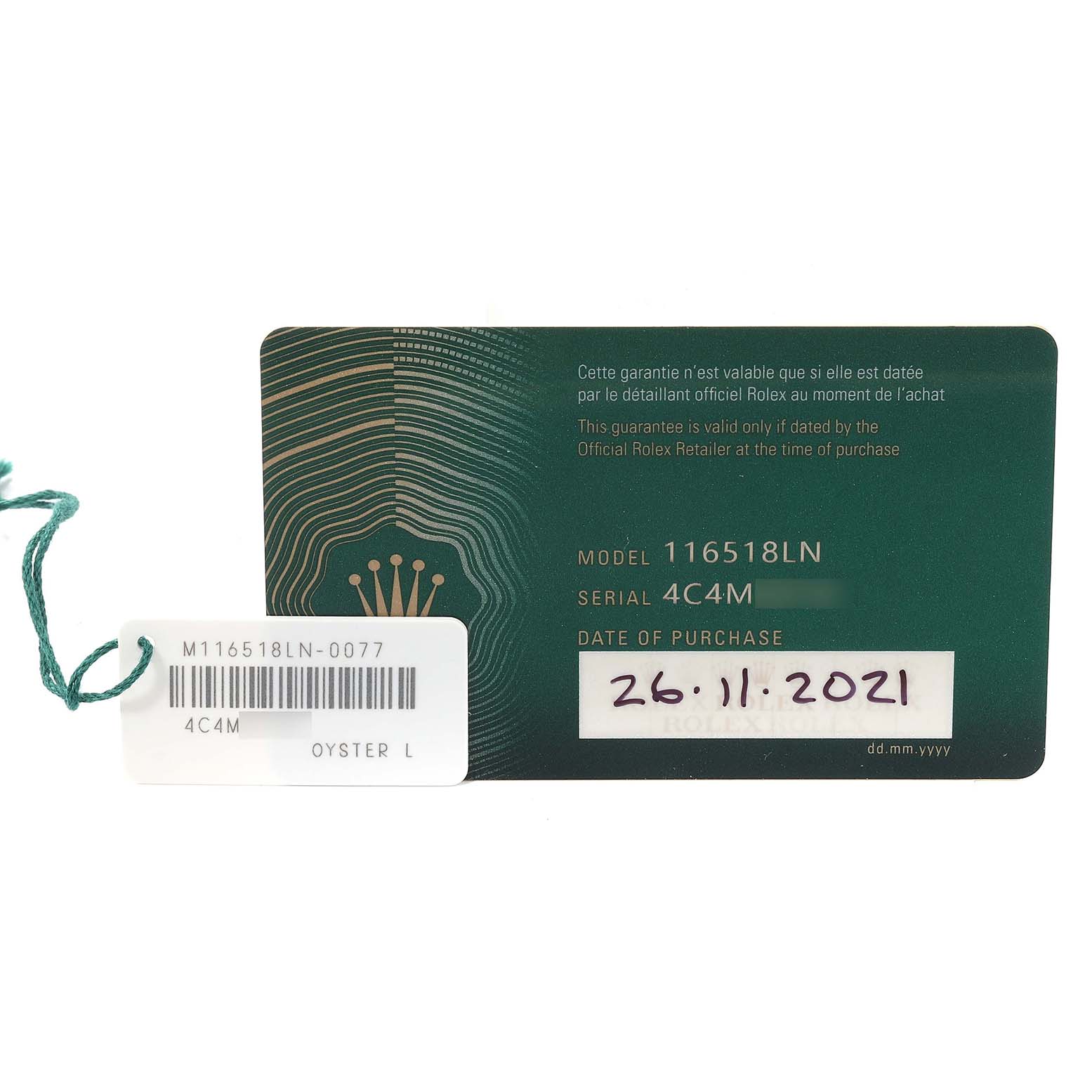 The image shows the warranty card and tag for a Rolex Daytona 116518 Men's Yellow Gold Black Dial 116518 Men's Yellow Gold Black Dial model 116518LN watch, displaying the serial number and purchase date.