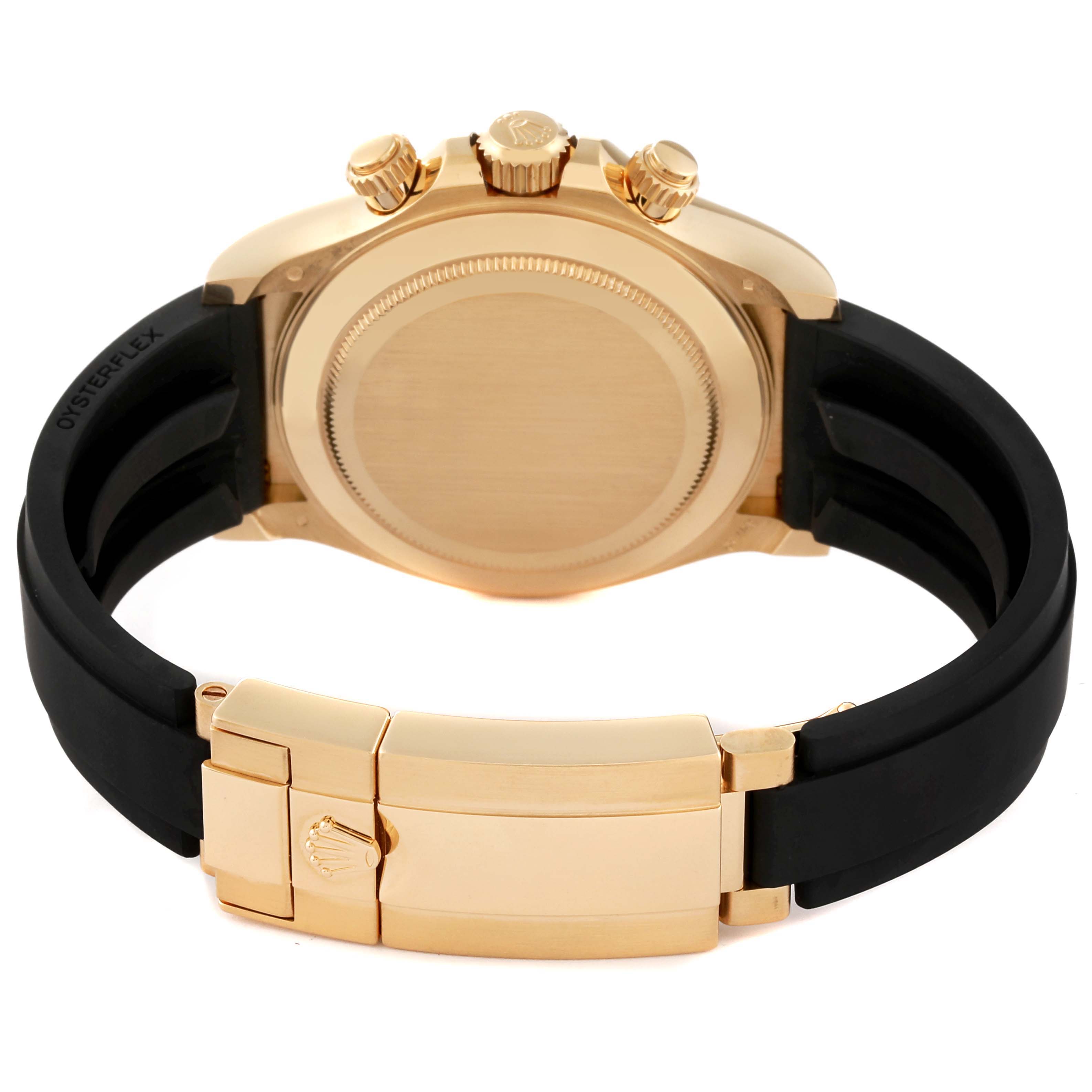 This image shows the back case, crown, pushers, and clasp of a Rolex Daytona 116518 Men's Yellow Gold Black Dial 116518 Men's Yellow Gold Black Dial watch.