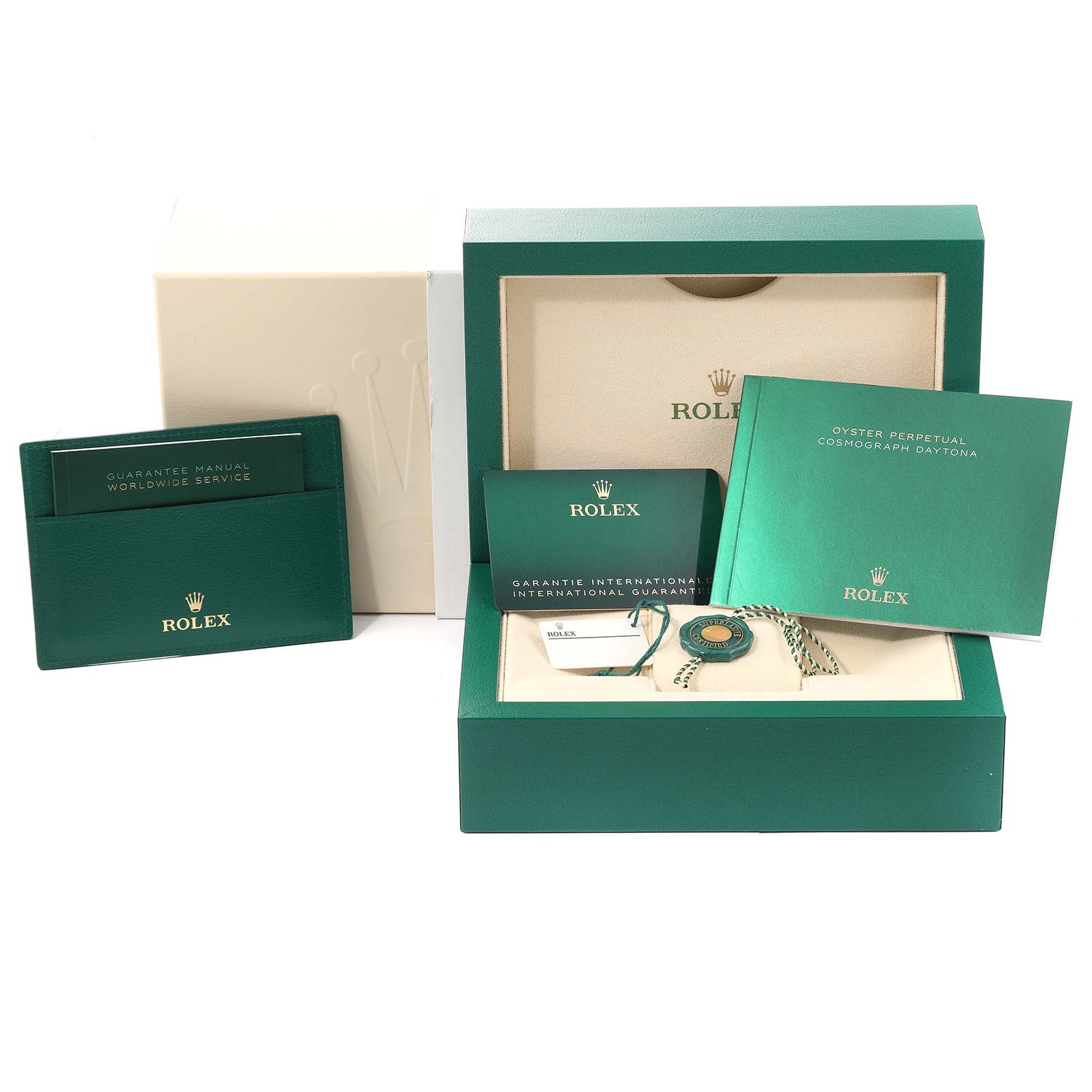 This image shows the packaging, manuals, and accessories for a Rolex Daytona 116518 Men's Yellow Gold Black Dial 116518 Men's Yellow Gold Black Dial watch, with a focus on the box and its contents.