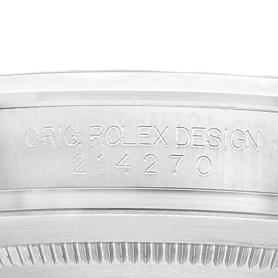 The image shows a close-up of the case side of the Rolex Explorer 214270 Men's Stainless Steel Black Dial, highlighting the model number engraving.
