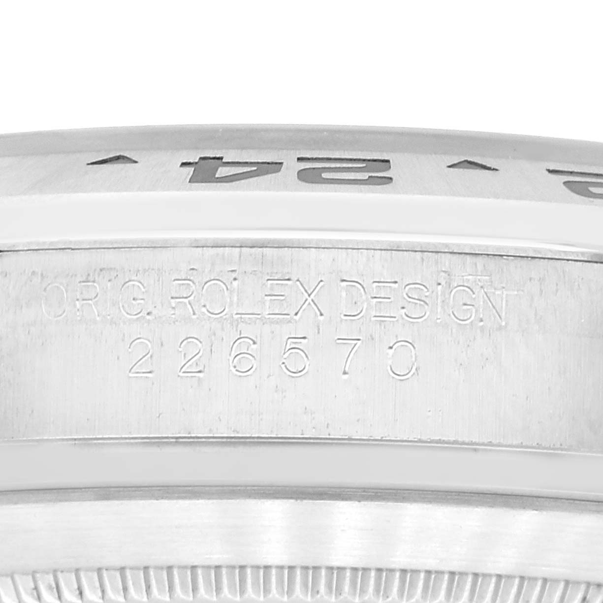 This image shows a close-up of the side engraving and the bezel of a Rolex Explorer 226570 Men
s Stainless Steel White Dial 226570 Men
s Stainless Steel White Dial model watch.