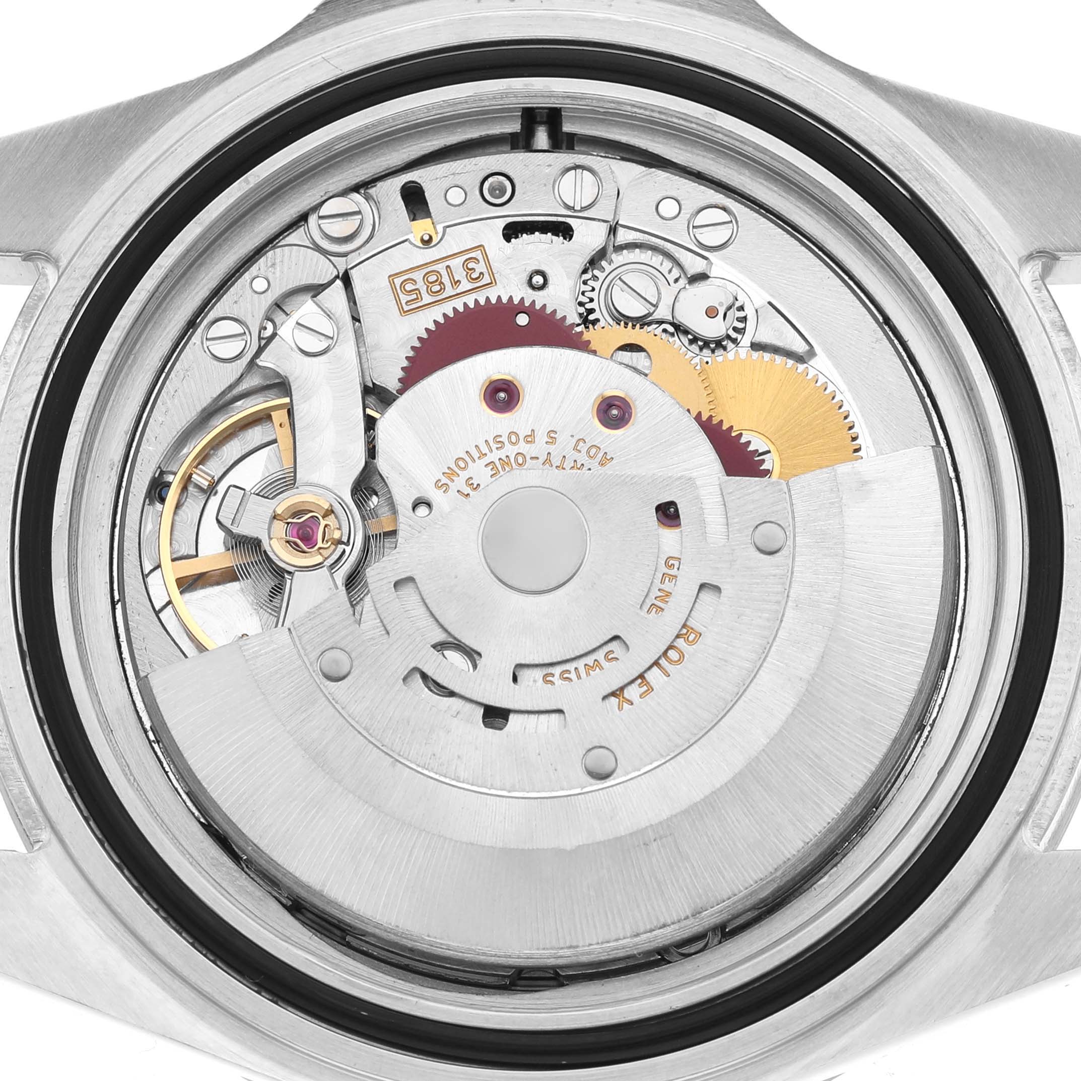 This image shows the movement and internal mechanics of a Rolex Explorer 16570 Men's Stainless Steel Black Dial watch from a rear angle, highlighting gears and the rotor.