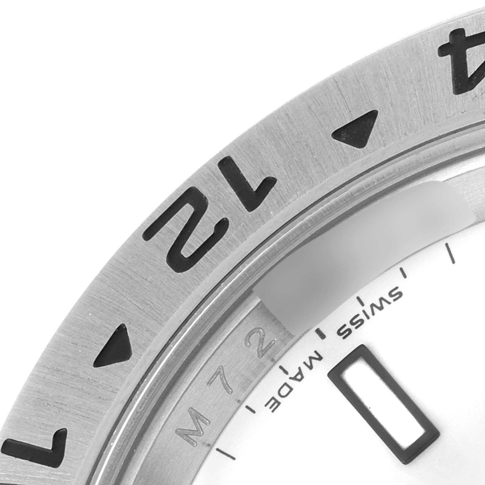 Close-up of the bezel, numbers, and part of the dial of a Rolex Explorer 16570 Men
s Stainless Steel White Dial 16570 Men
s Stainless Steel White Dial watch.