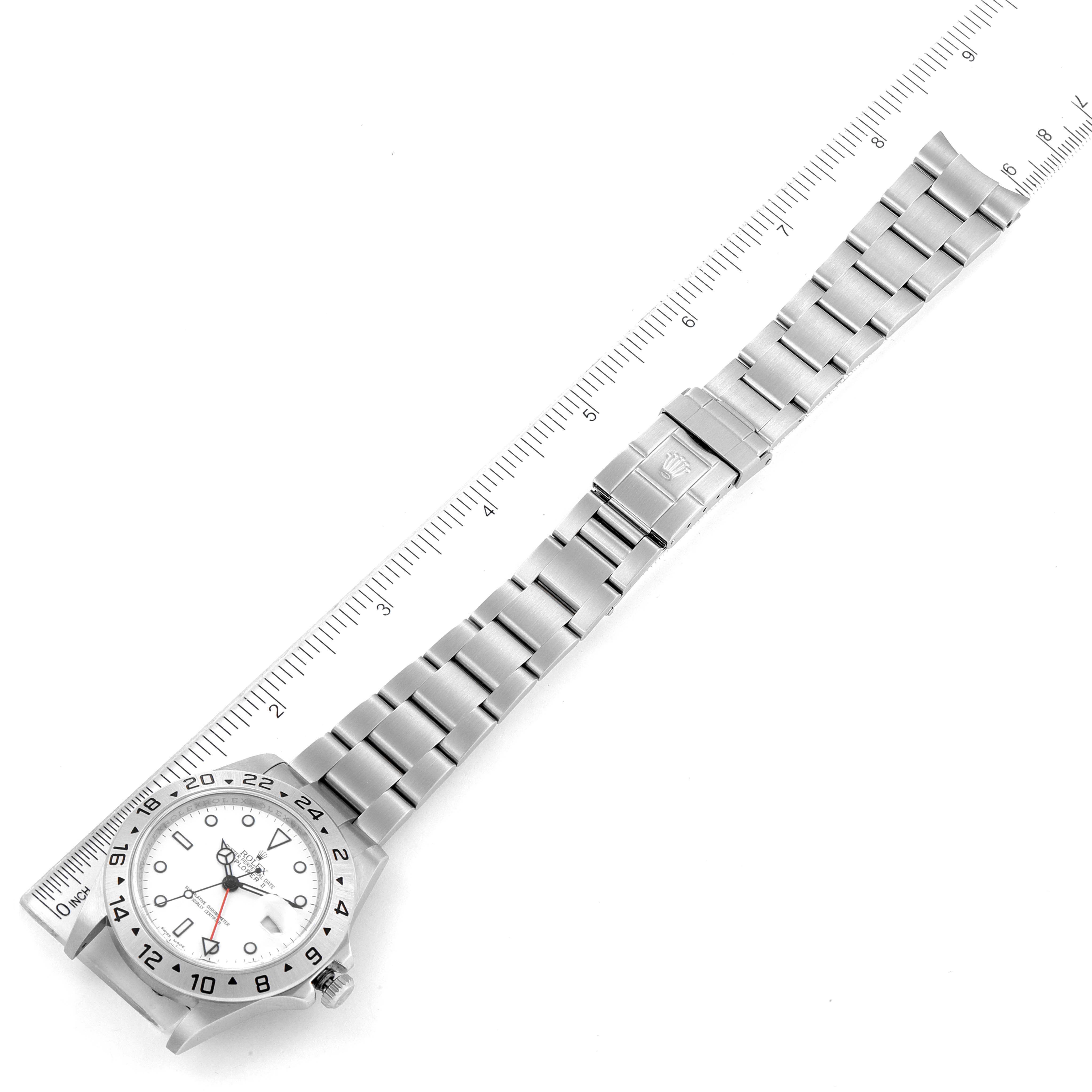 The image shows a full view of the Rolex Explorer 16570 Men
s Stainless Steel White Dial 16570 Men
s Stainless Steel White Dial watch laid flat next to a ruler for scale measurements.