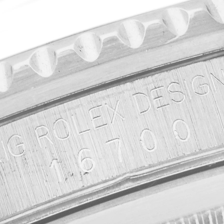 The image shows a close-up of the side engraving on the case of a Rolex GMT-Master 16700 Men's Stainless Steel Black Dial 16700 Men's Stainless Steel Black Dial, highlighting the model number.