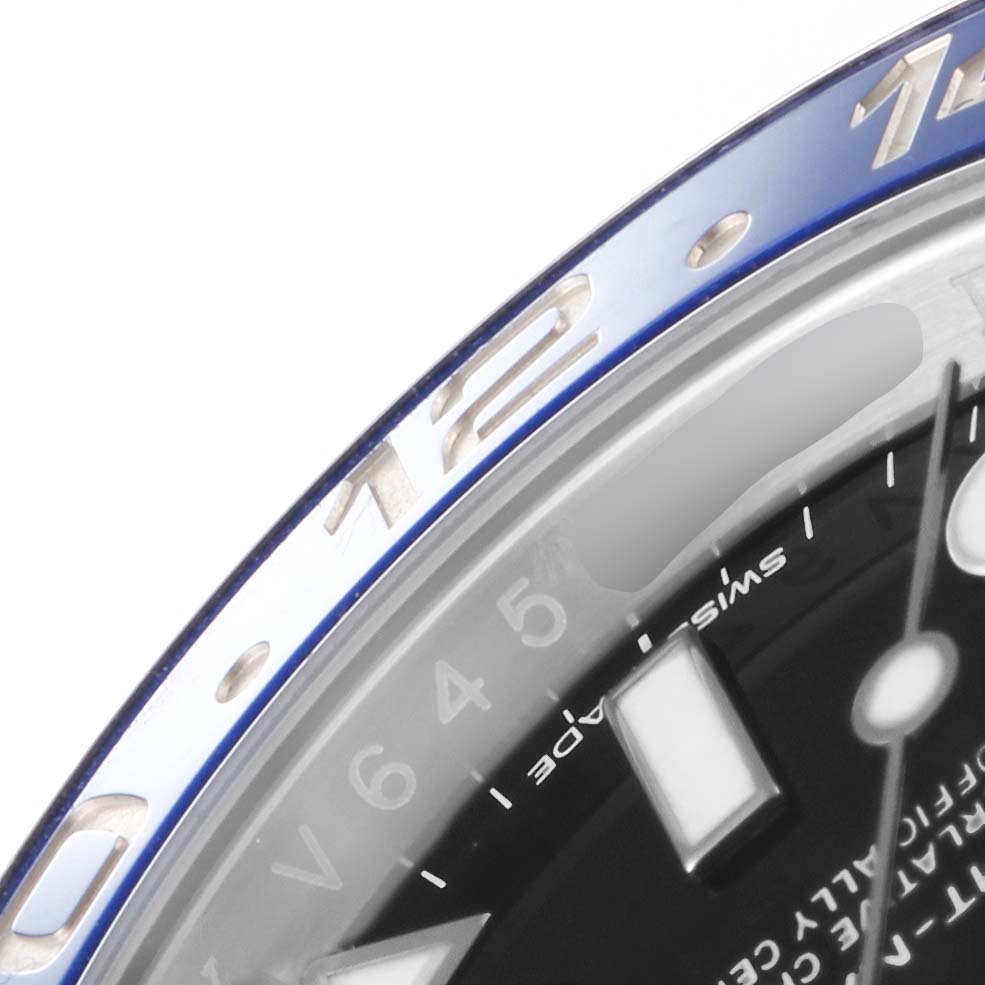 The image shows a close-up of the bezel and partial dial of a Rolex GMT-Master 116710 Men's Stainless Steel Black Dial 116710 Men's Stainless Steel Black Dial watch.