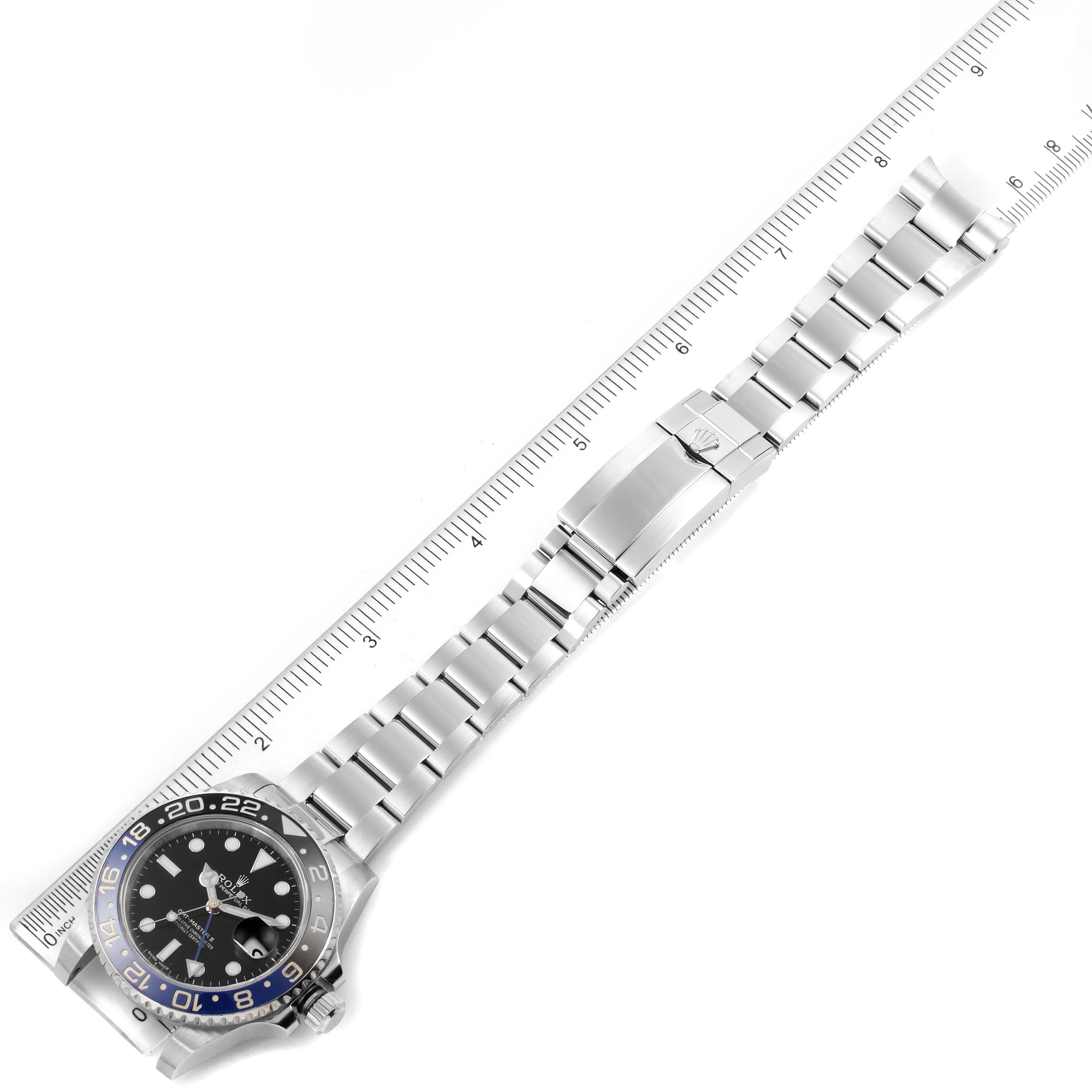 The image shows a Rolex GMT-Master 116710 Men's Stainless Steel Black Dial 116710 Men's Stainless Steel Black Dial watch lying flat, with its face and stainless steel bracelet fully extended next to a ruler.