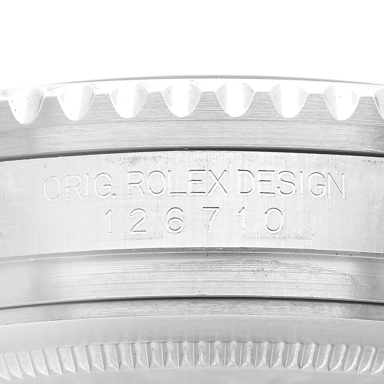 The image shows a close-up view of the engraved bezel and serial number of a Rolex GMT-Master 126710BLRO Men
s Stainless Steel Black Dial 126710BLRO Men
s Stainless Steel Black Dial model.