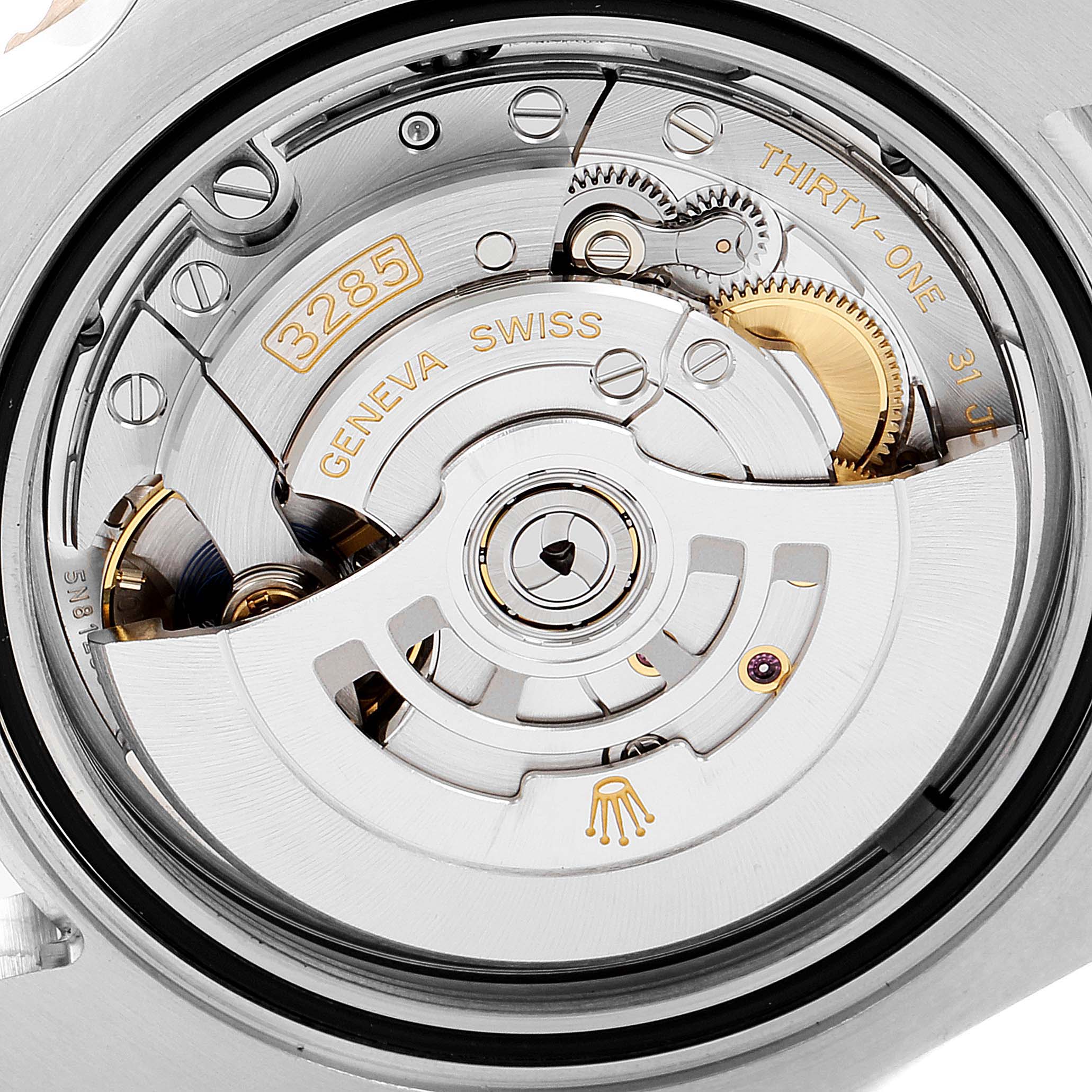 This image shows the intricate movement and internal mechanism of a Rolex GMT-Master 126711CHNR Men's Steel and Gold (two tone) Black Dial 126711CHNR Men's Steel and Gold (two tone) Black Dial watch, specifically the caliber 3285.