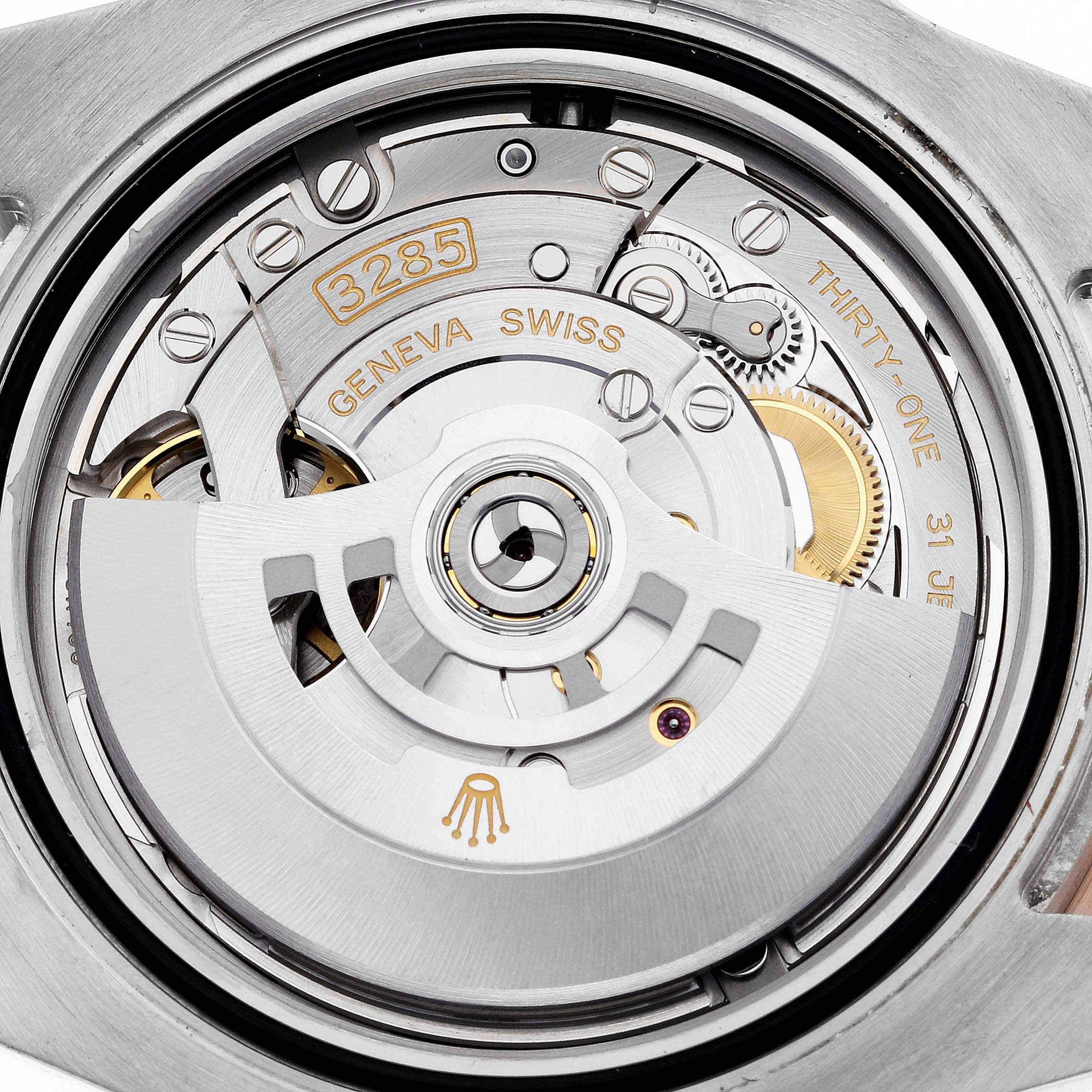 The image shows a close-up of the movement inside a Rolex GMT-Master 126711CHNR Men's Steel and Gold (two tone) Black Dial 126711CHNR Men's Steel and Gold (two tone) Black Dial watch, highlighting the caliber 3285 mechanism.