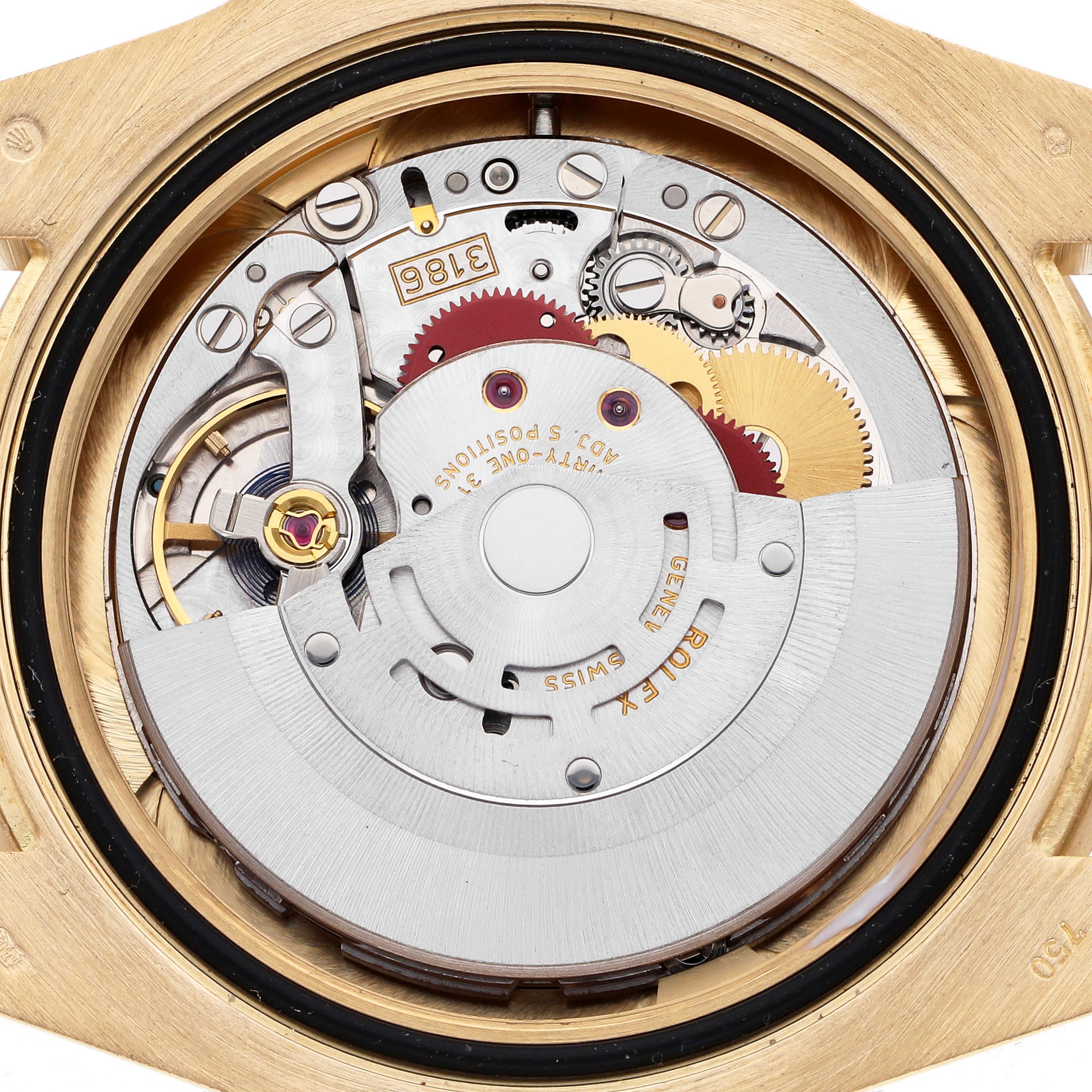 The image shows the movement mechanism of a Rolex GMT-Master 116718 Men
s Yellow Gold Black Dial 116718 Men
s Yellow Gold Black Dial watch, viewed from the back case with gears and components visible.