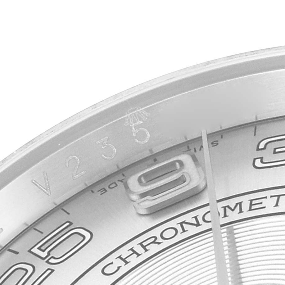 This is a close-up of the dial, bezel, and minute hand of a Rolex Oyster Perpetual 116000 Men's Stainless Steel Silver Dial 116000 Men's Stainless Steel Silver Dial watch, showing the "9" and "3" hour markers.