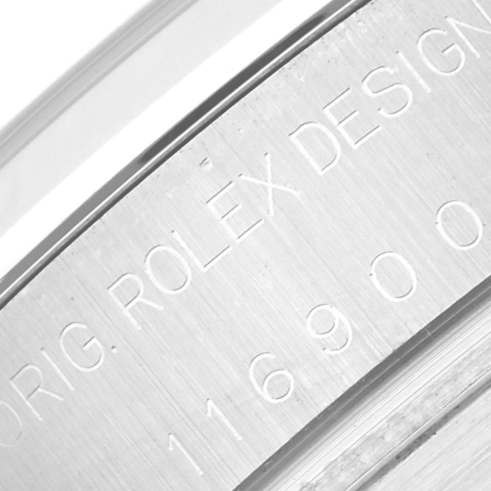 This close-up image shows the engraved serial number and "Rolex Design" on the case of a Rolex Air-King 116900 Men's Stainless Steel Black Dial 116900 Men's Stainless Steel Black Dial watch.