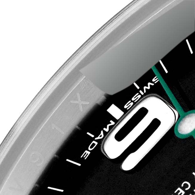 This close-up angle of the Rolex Air-King 116900 Men's Stainless Steel Black Dial 116900 Men's Stainless Steel Black Dial watch highlights part of the dial, showcasing the "9" hour marker and the "Swiss Made" text.