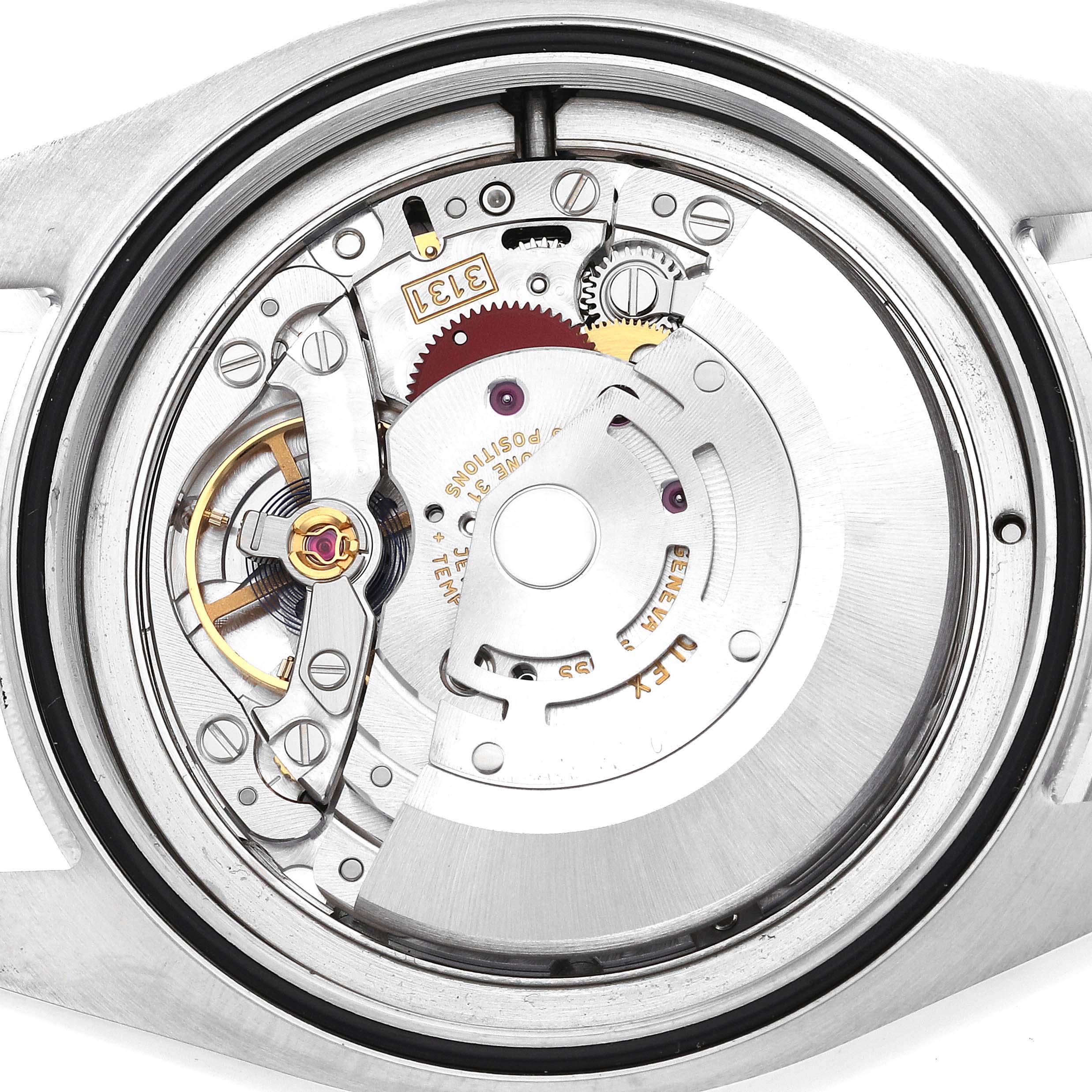 This close-up image shows the internal movement mechanism of a Rolex Air-King 116900 Men's Stainless Steel Black Dial 116900 Men's Stainless Steel Black Dial watch from the back angle.
