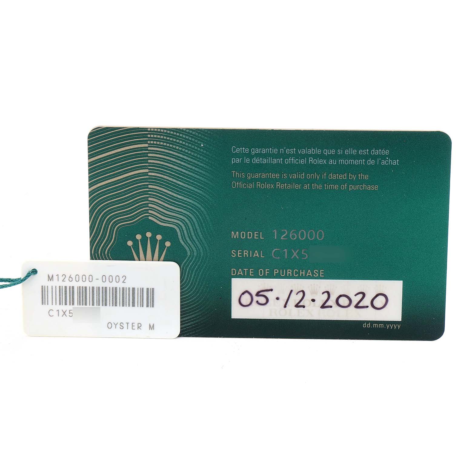 The image shows a Rolex Oyster Perpetual 126000 Men's Stainless Steel Black Dial warranty card and a separate tag with model and serial numbers.