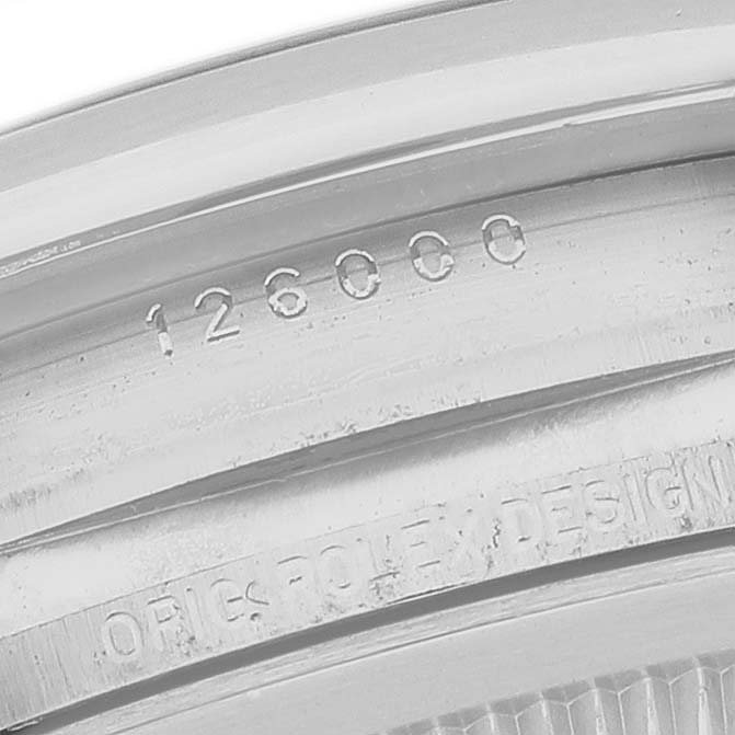 The image shows the inner rim of the case back with engravings of the Rolex Oyster Perpetual 126000 Men's Stainless Steel Black Dial model.