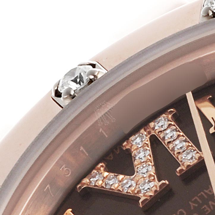 The image shows a close-up of the Rolex Pearlmaster 80315 Women's Rose Gold Brown Dial 80315 Women's Rose Gold Brown Dial's bezel and diamond-studded Roman numeral on the dial at an angled view.