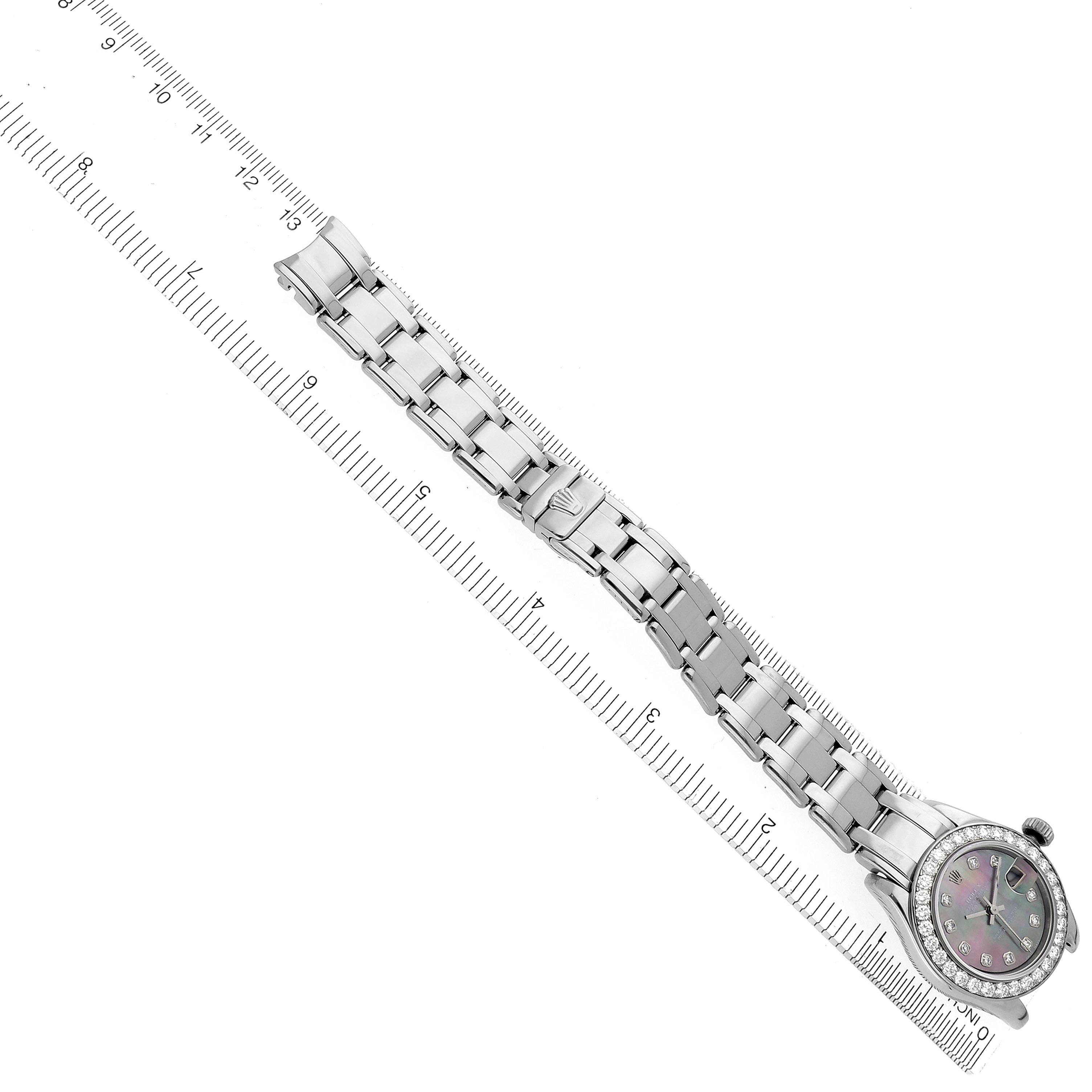 The Rolex Pearlmaster 69299 Women
s White Gold Mother of Pearl Dial 69299 Women
s White Gold Mother of Pearl Dial watch is shown in a top-down angle, displaying the full bracelet and case.