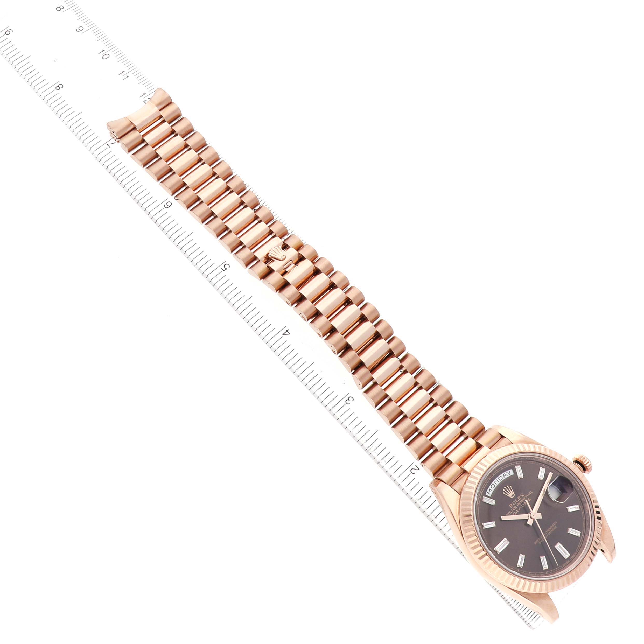 The Rolex President 228235 Men's Rose Gold Brown Dial model watch is shown from a top angle, displaying the bracelet, dial, and case.