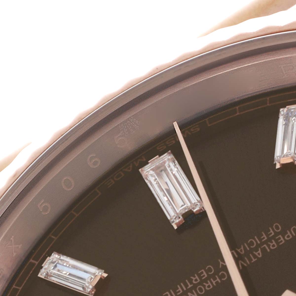 The image shows a close-up of the dial and bezel of the Rolex President 228235 Men
s Rose Gold Brown Dial 228235 Men
s Rose Gold Brown Dial model, highlighting diamond hour markers.