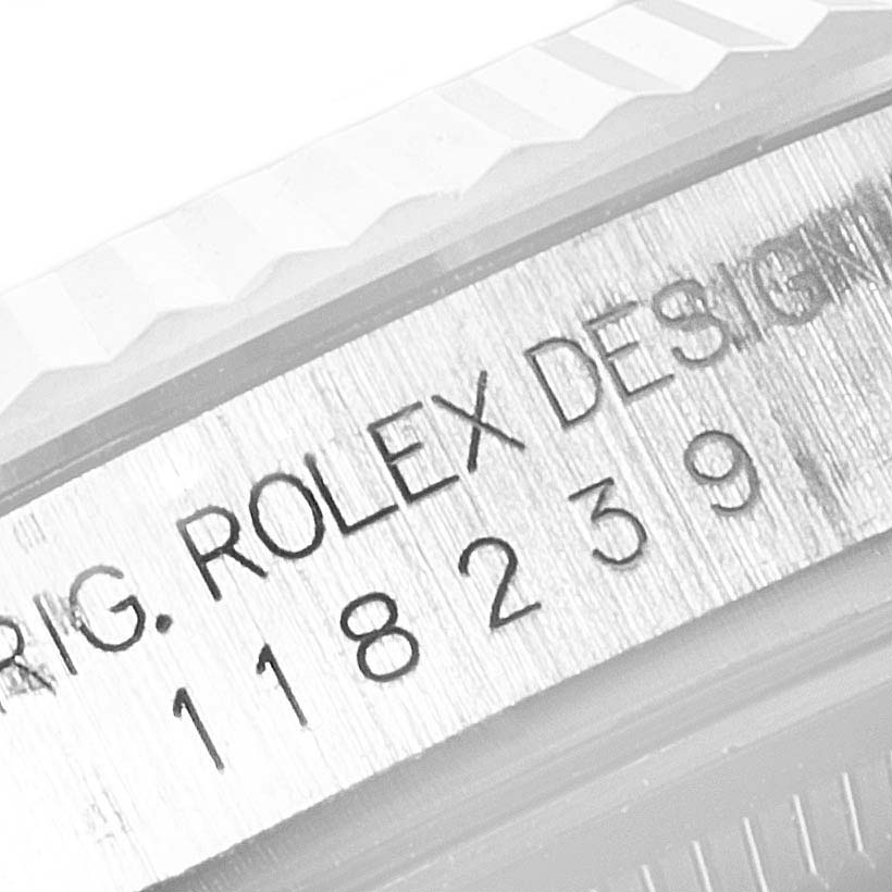 This image shows a close-up of the engraved model number on the case of a Rolex President 118239 Men
s White Gold Silver Dial 118239 Men
s White Gold Silver Dial watch.