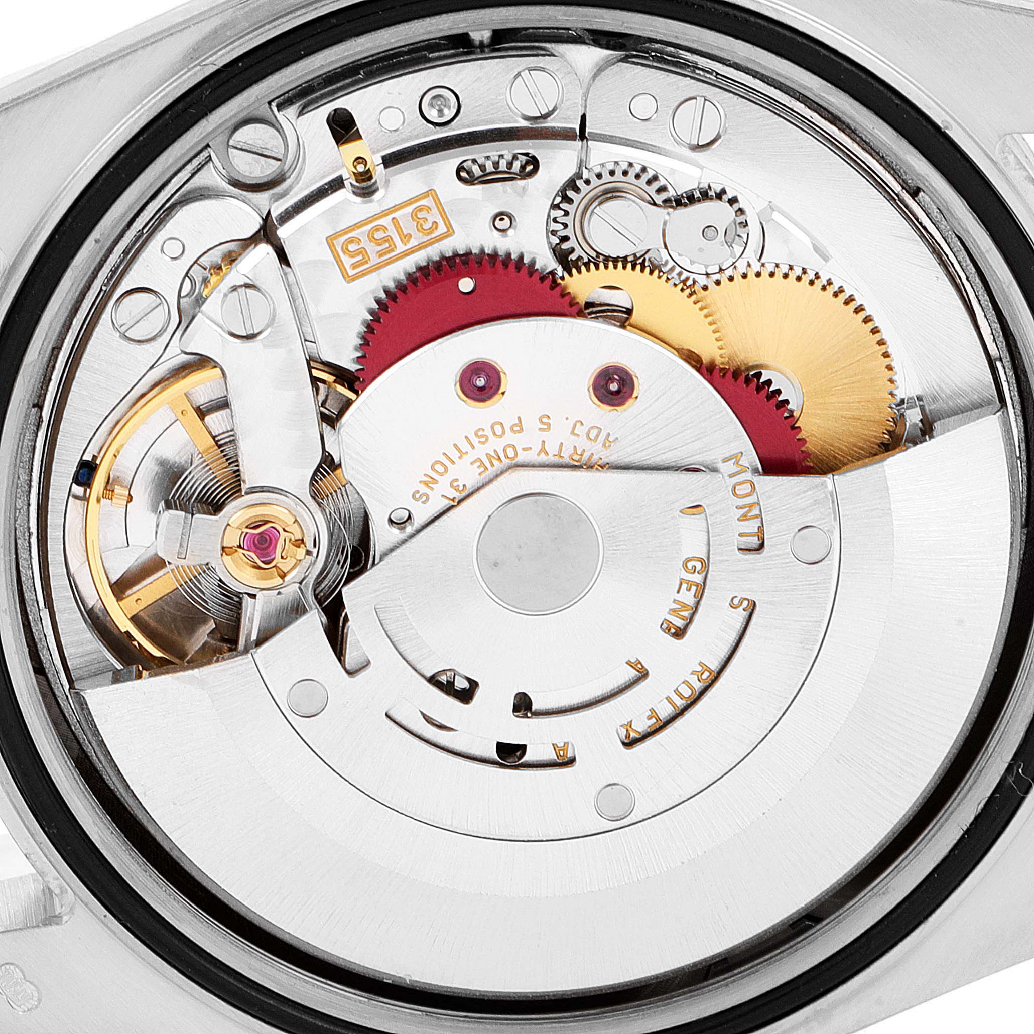 The image shows a close-up of the internal mechanism of the Rolex President 118239 Men
s White Gold Silver Dial 118239 Men
s White Gold Silver Dial model watch, highlighting its intricate gears and components.