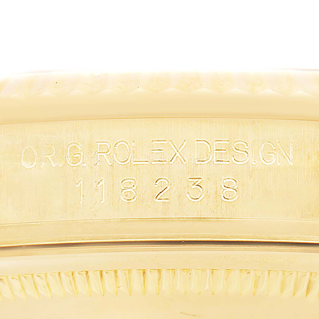 The image shows the side engraving on the case of a Rolex President 118238 Men's Yellow Gold Champagne Dial model, displaying the design number.