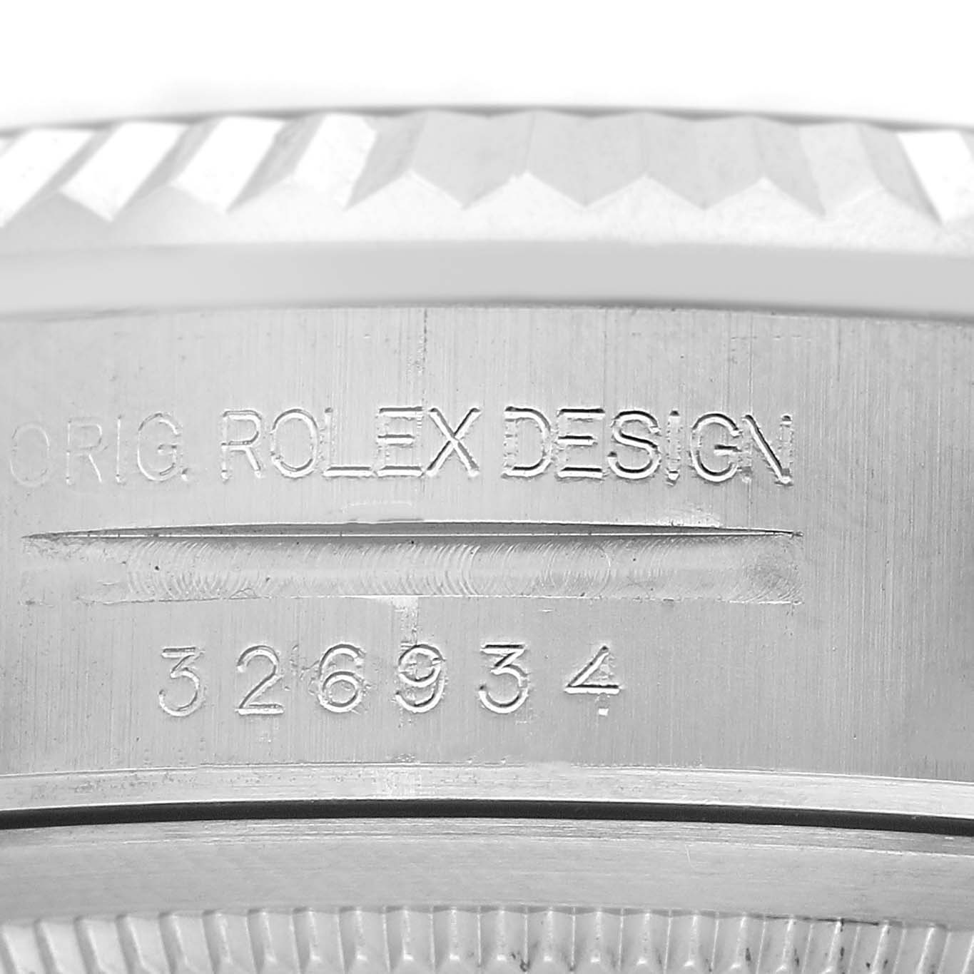 The image shows a close-up of the side view of a Rolex Sky-Dweller 326934 Men's Stainless Steel Black Dial, highlighting the engraved design and model number.