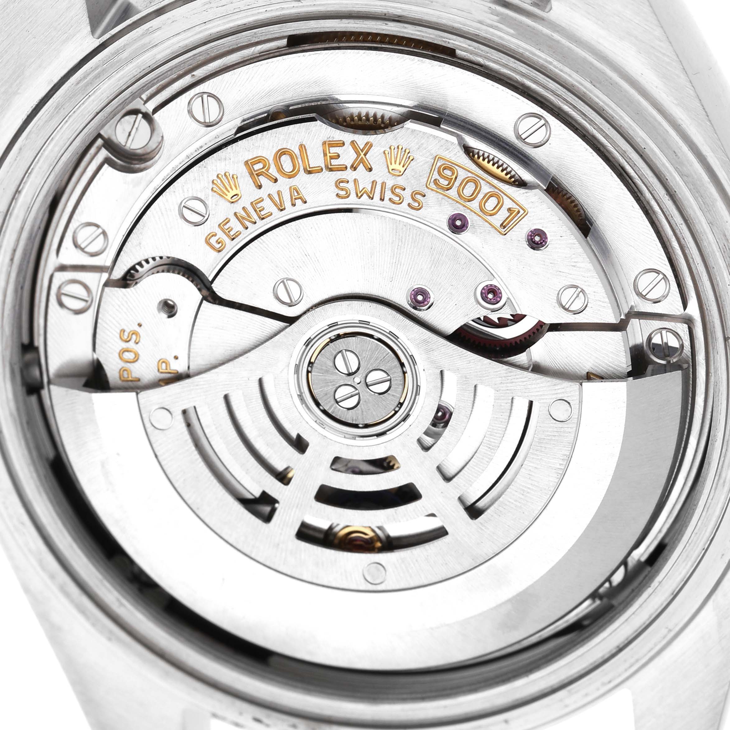 The image shows a close-up of the movement mechanism of a Rolex Sky-Dweller 326934 Men's Stainless Steel Black Dial, highlighting the rotor and engravings.