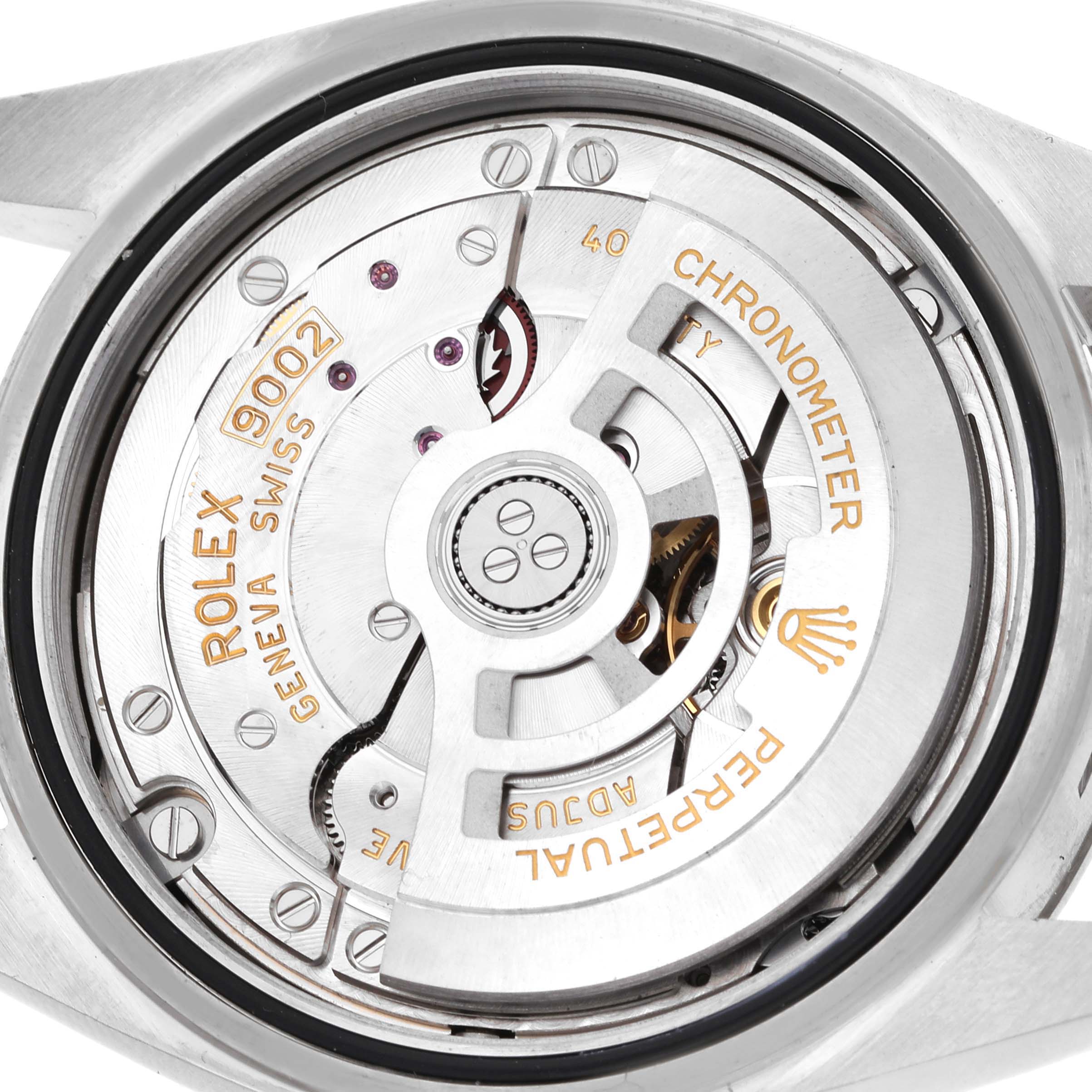 The Rolex Sky-Dweller 336934 Men's Stainless Steel White Dial watch is shown from a rear angle, revealing its movement and automatic rotor.