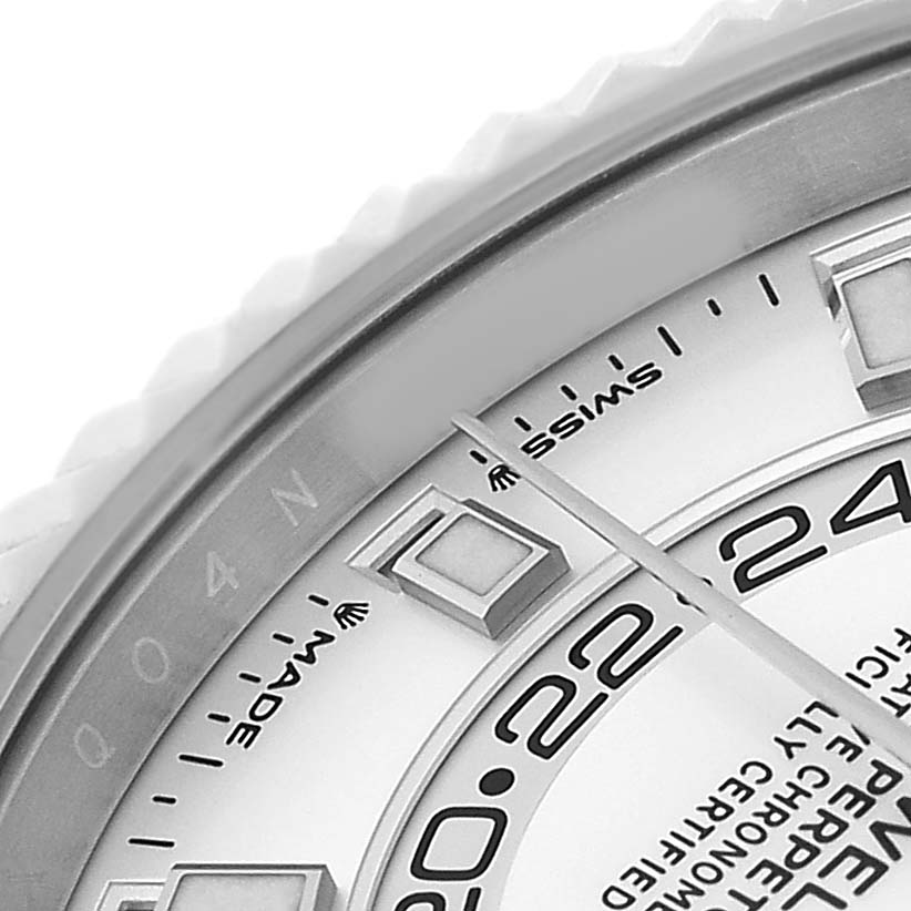 This image shows a close-up of the bezel, chapter ring, and partial dial of a Rolex Sky-Dweller 336934 Men's Stainless Steel White Dial watch.