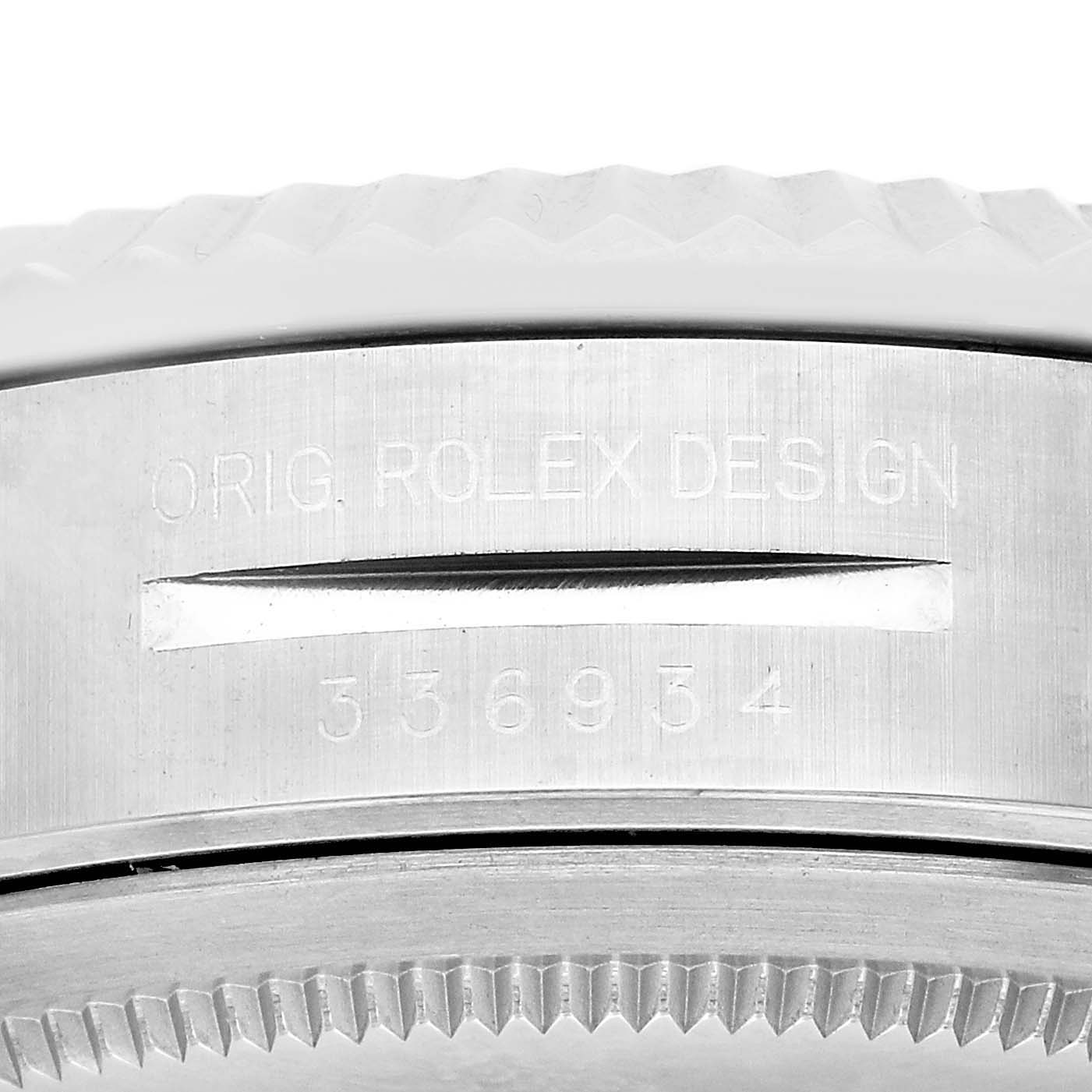 The image shows a close-up of the side of a Rolex Sky-Dweller 336934 Men's Stainless Steel White Dial watch, highlighting the branding and design engraving.