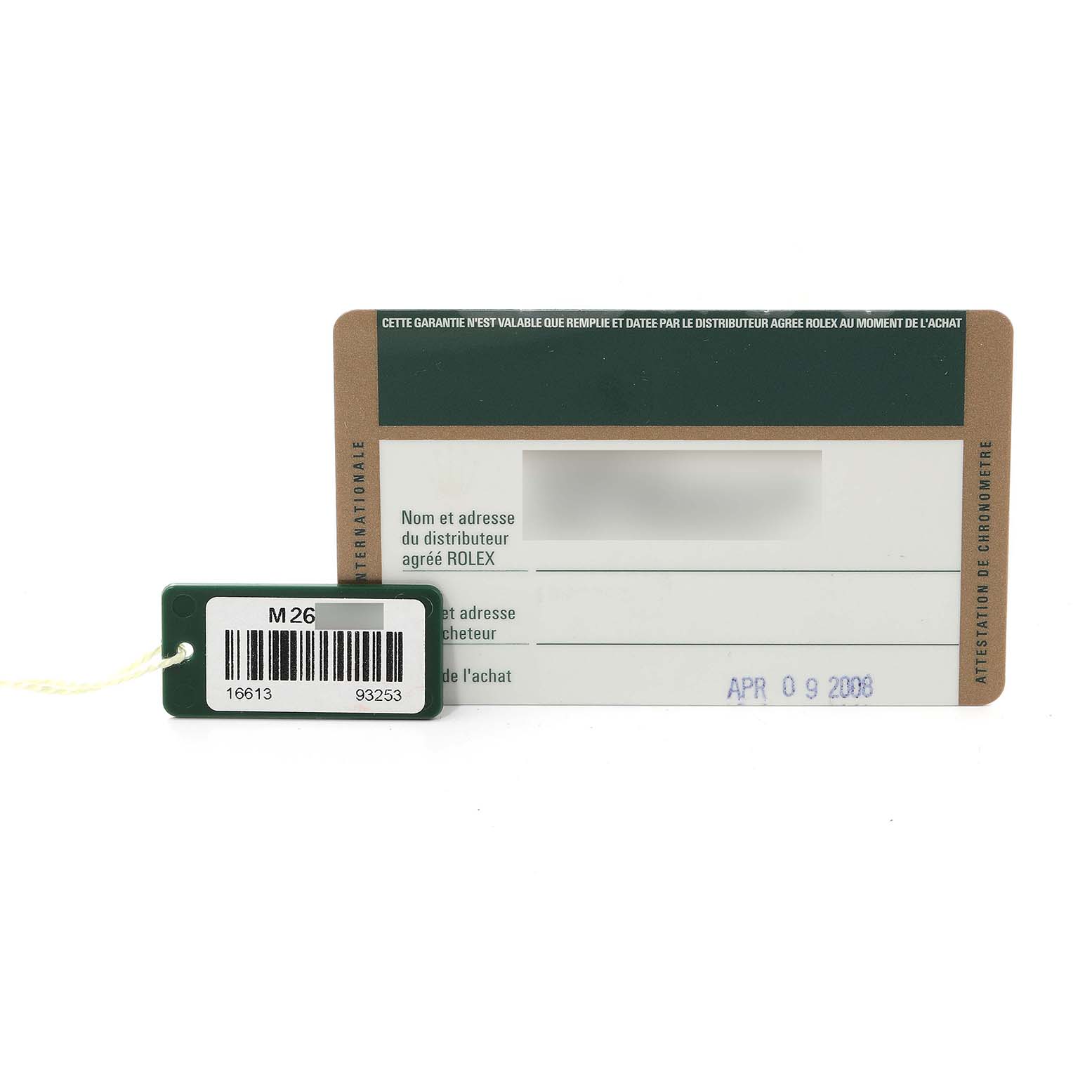 The image shows the warranty card and a tag for the Rolex Submariner 16613 Men's Steel and Gold (two tone) Blue Dial 16613 Men's Steel and Gold (two tone) Blue Dial watch, photographed from the front.