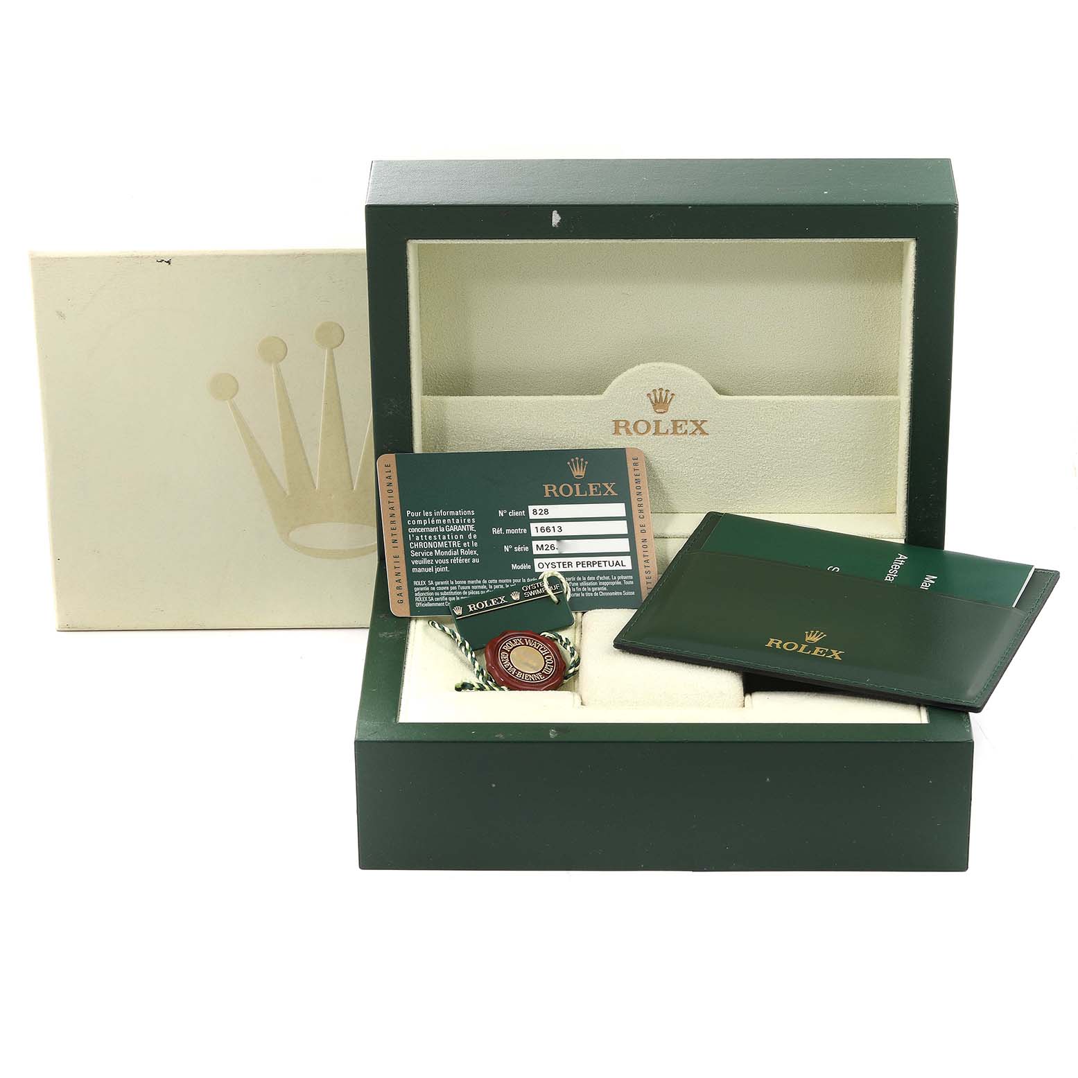 The image shows the packaging, warranty card, tag, and documentation of a Rolex Submariner 16613 Men's Steel and Gold (two tone) Blue Dial 16613 Men's Steel and Gold (two tone) Blue Dial watch.