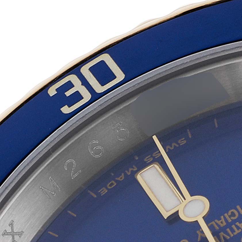 The image shows a close-up of the bezel and dial of a Rolex Submariner 16613 Men's Steel and Gold (two tone) Blue Dial 16613 Men's Steel and Gold (two tone) Blue Dial, particularly the "30" mark with a portion of the watch's minute hand.