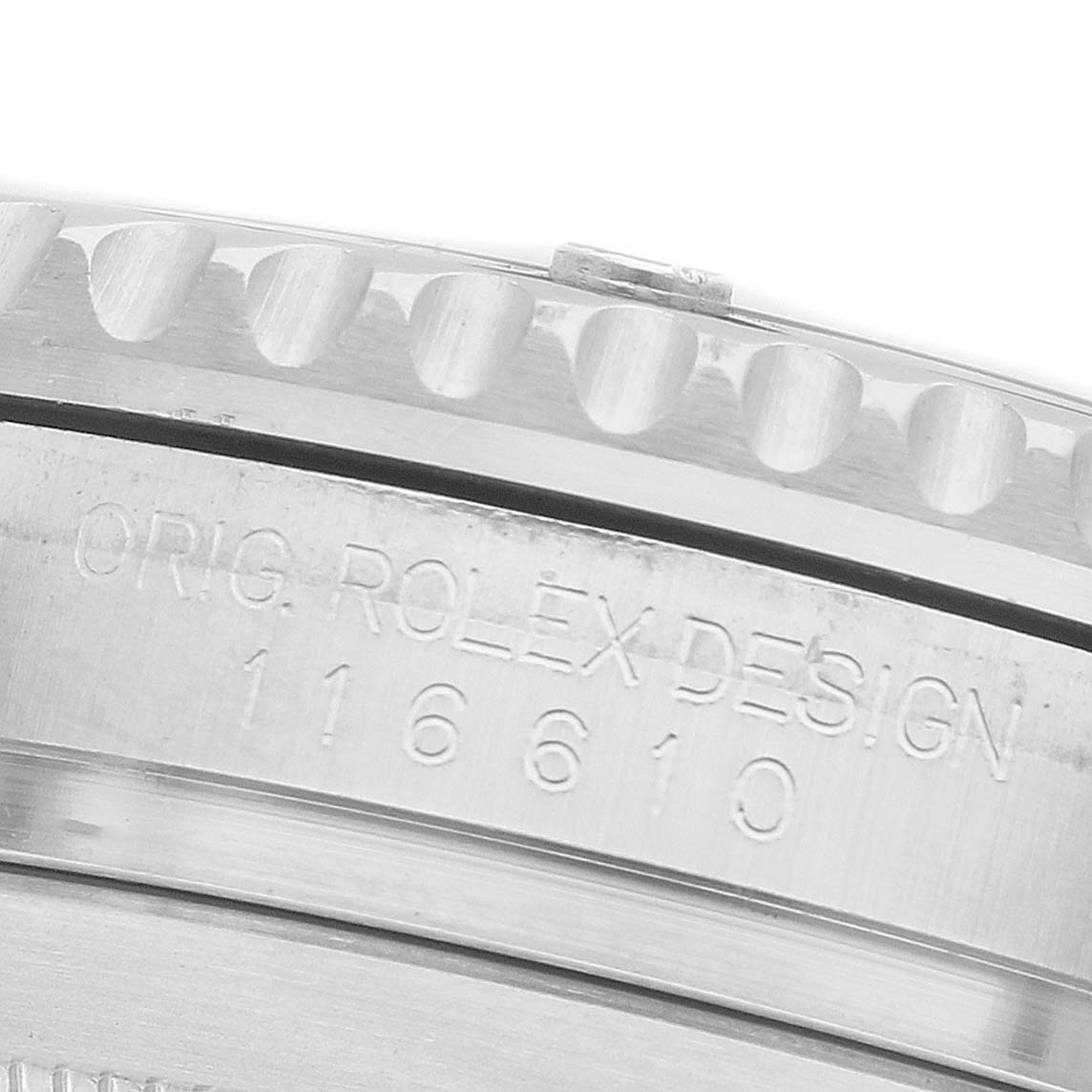 The image shows a close-up of the Rolex Submariner 116610LV Men's Stainless Steel Green Dial's bezel and case side, engraved with "ORIG. ROLEX DESIGN 116610."