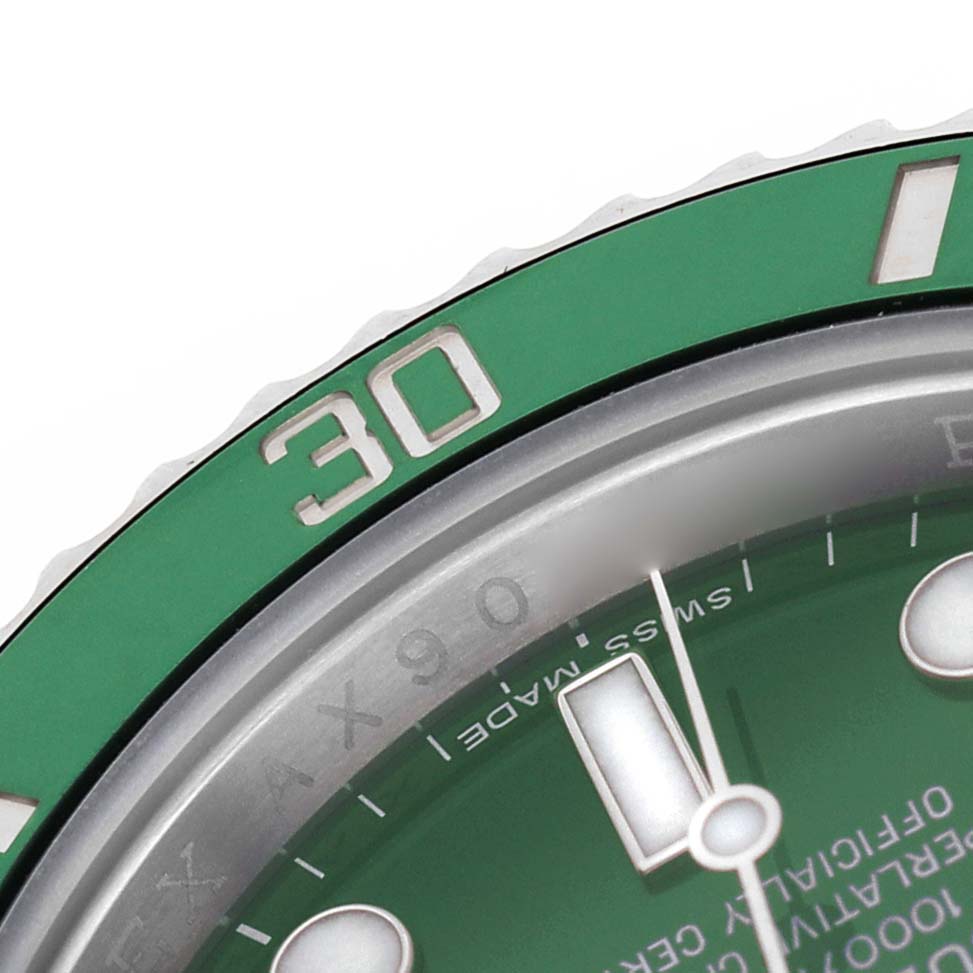 The image shows a close-up of the bezel and part of the dial of a Rolex Submariner 116610LV Men's Stainless Steel Green Dial, highlighting the "30" marker.
