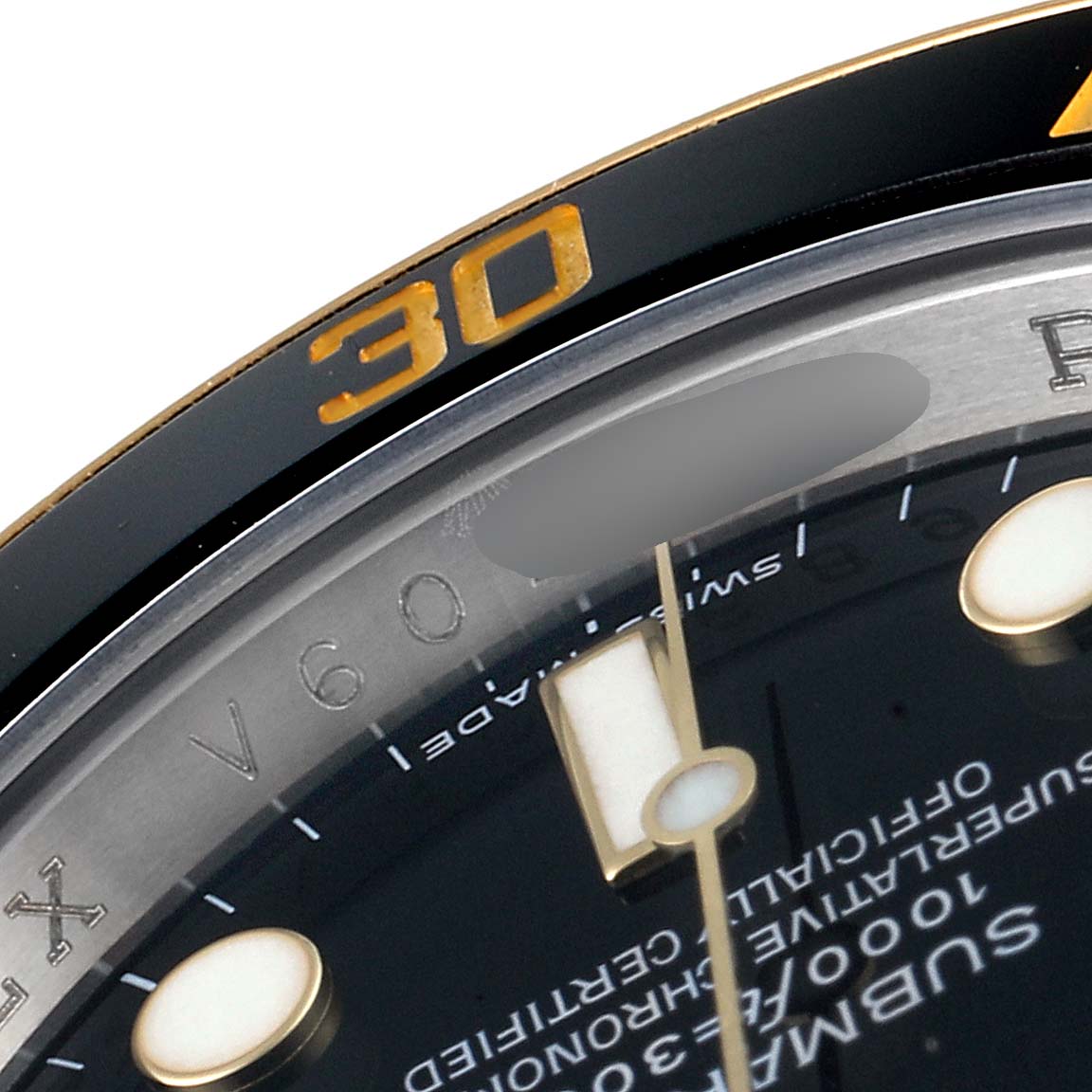 This close-up image shows the bezel and part of the dial of a Rolex Submariner 116613 Men's Steel and Gold (two tone) Black Dial 116613 Men's Steel and Gold (two tone) Black Dial watch, highlighting the 30-minute mark.