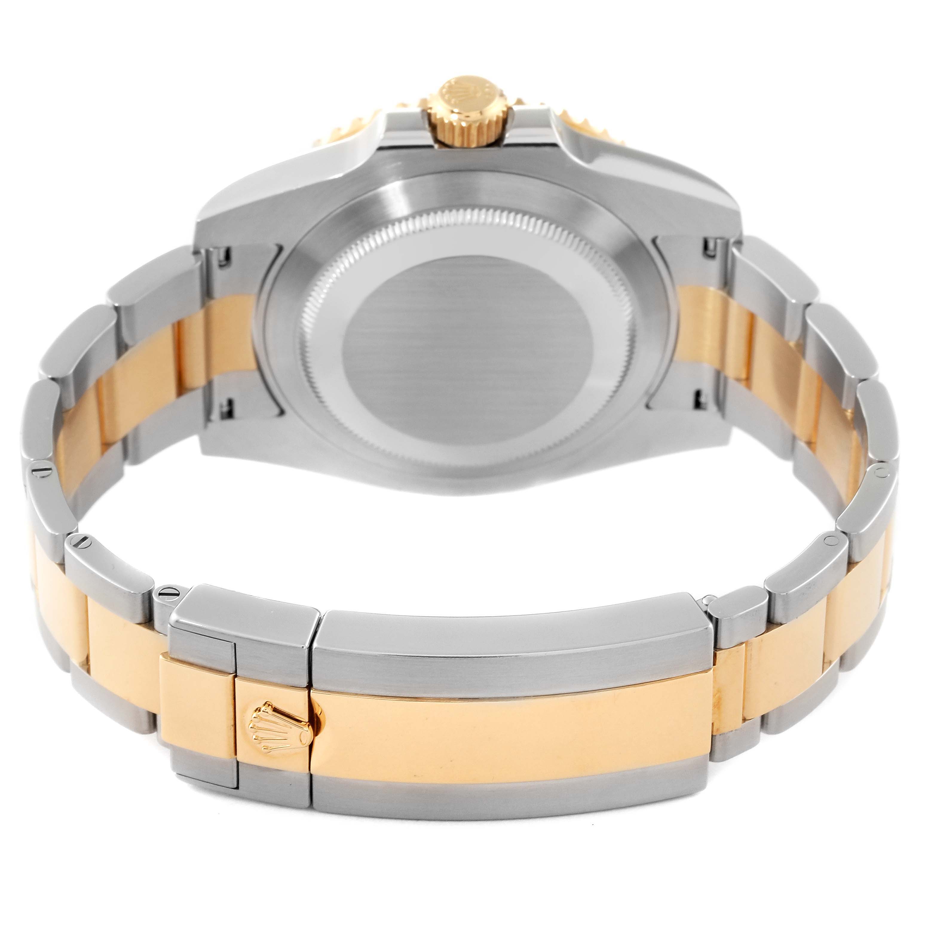 This image shows the back view of a Rolex Submariner 116613 Men's Steel and Gold (two tone) Black Dial 116613 Men's Steel and Gold (two tone) Black Dial watch, highlighting the stainless steel and gold bracelet and clasp.