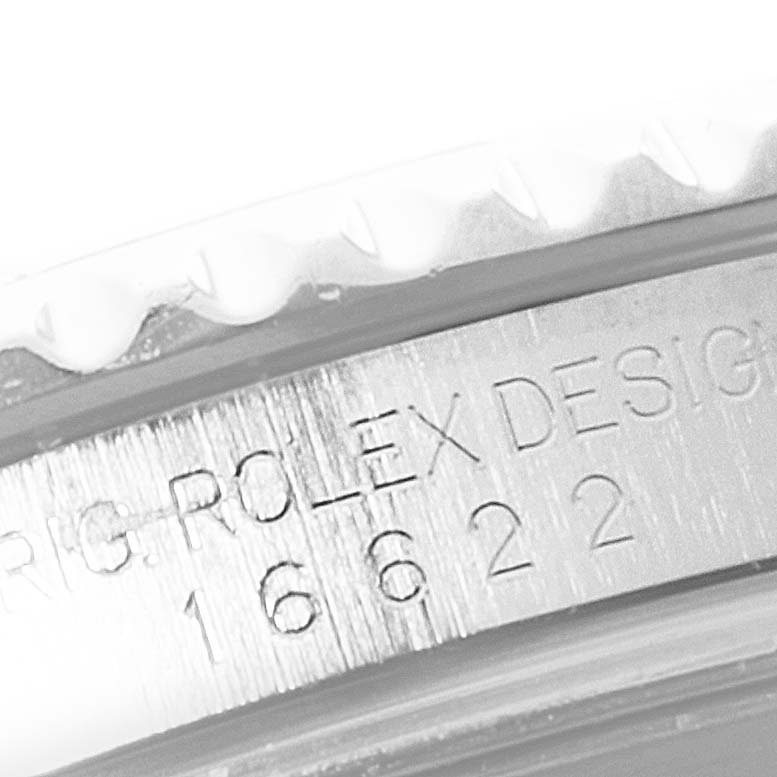 Close-up of the bezel and engravings on a Rolex Yacht-Master 16622 Men
s Stainless Steel Silver Dial 16622 Men
s Stainless Steel Silver Dial watch, showcasing "Rolex Design 16622" text.