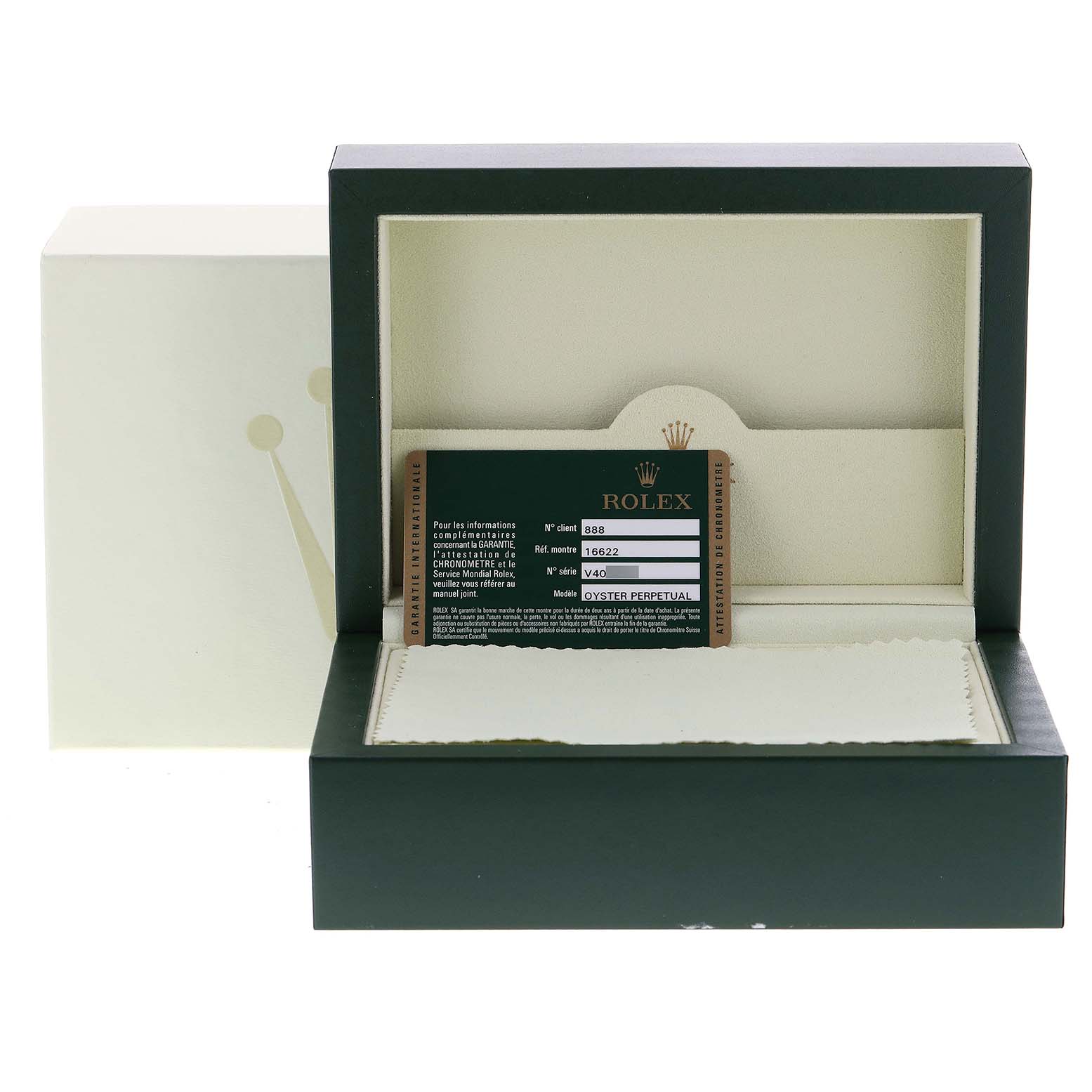 This image shows an open Rolex Yacht-Master 16622 Men
s Stainless Steel Silver Dial 16622 Men
s Stainless Steel Silver Dial watch box containing a warranty card and cloth.