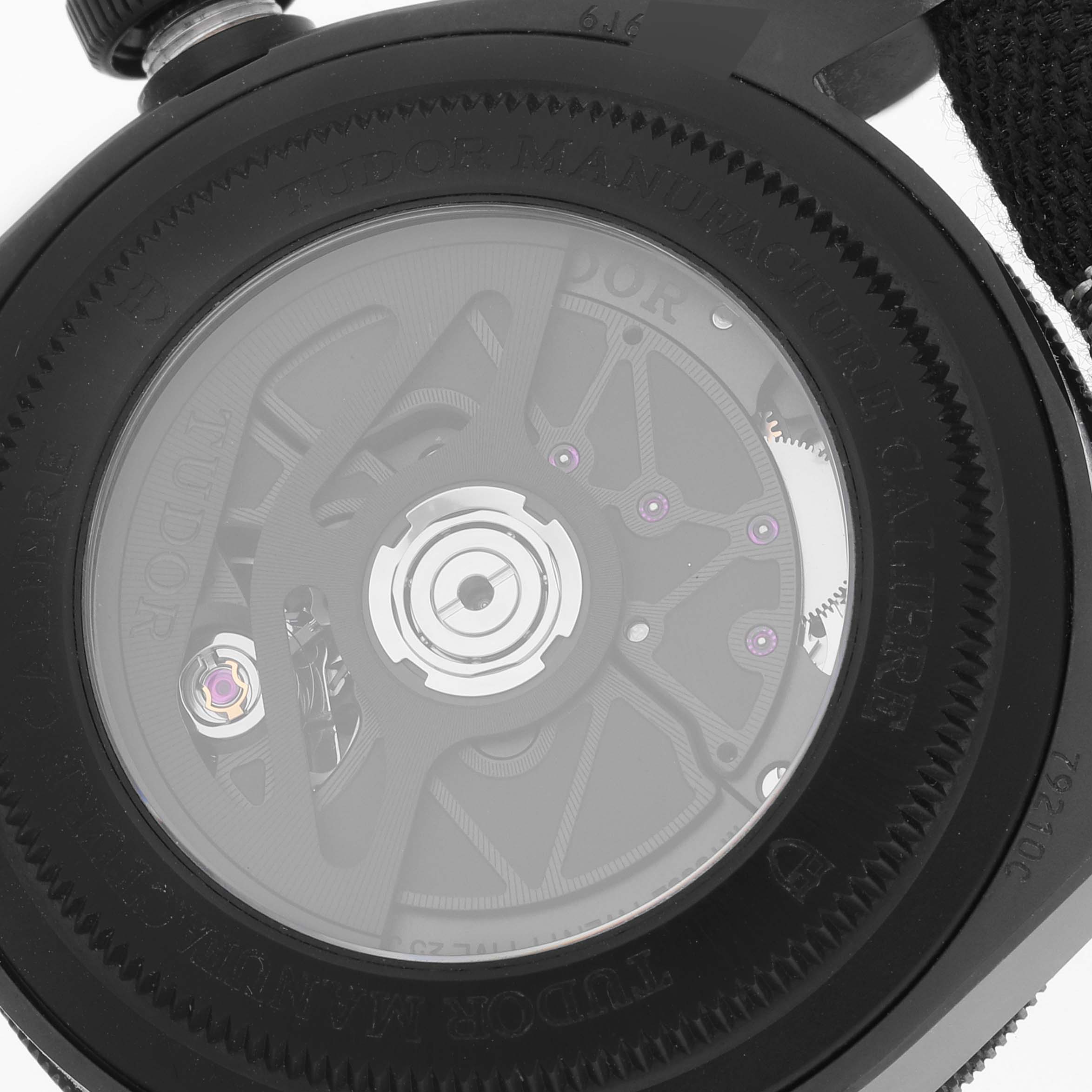 This image shows the back view of the Tudor Heritage Black Bay 79210CNU Men's Ceramic Black Dial 79210CNU Men's Ceramic Black Dial watch, highlighting its intricate movement mechanism.