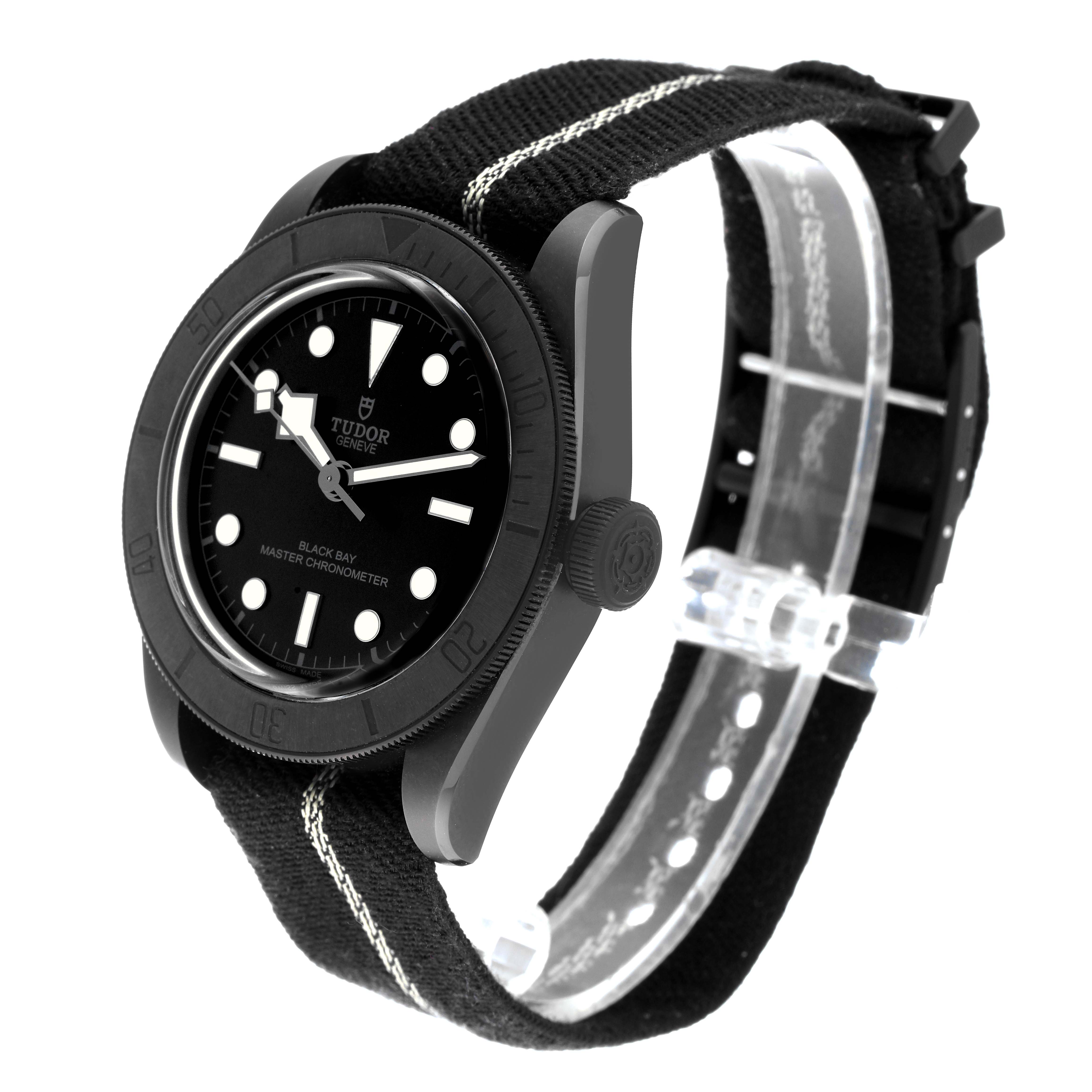 The image shows a Tudor Heritage Black Bay 79210CNU Men's Ceramic Black Dial 79210CNU Men's Ceramic Black Dial watch at a three-quarter angle, featuring its black dial, bezel, and fabric strap.